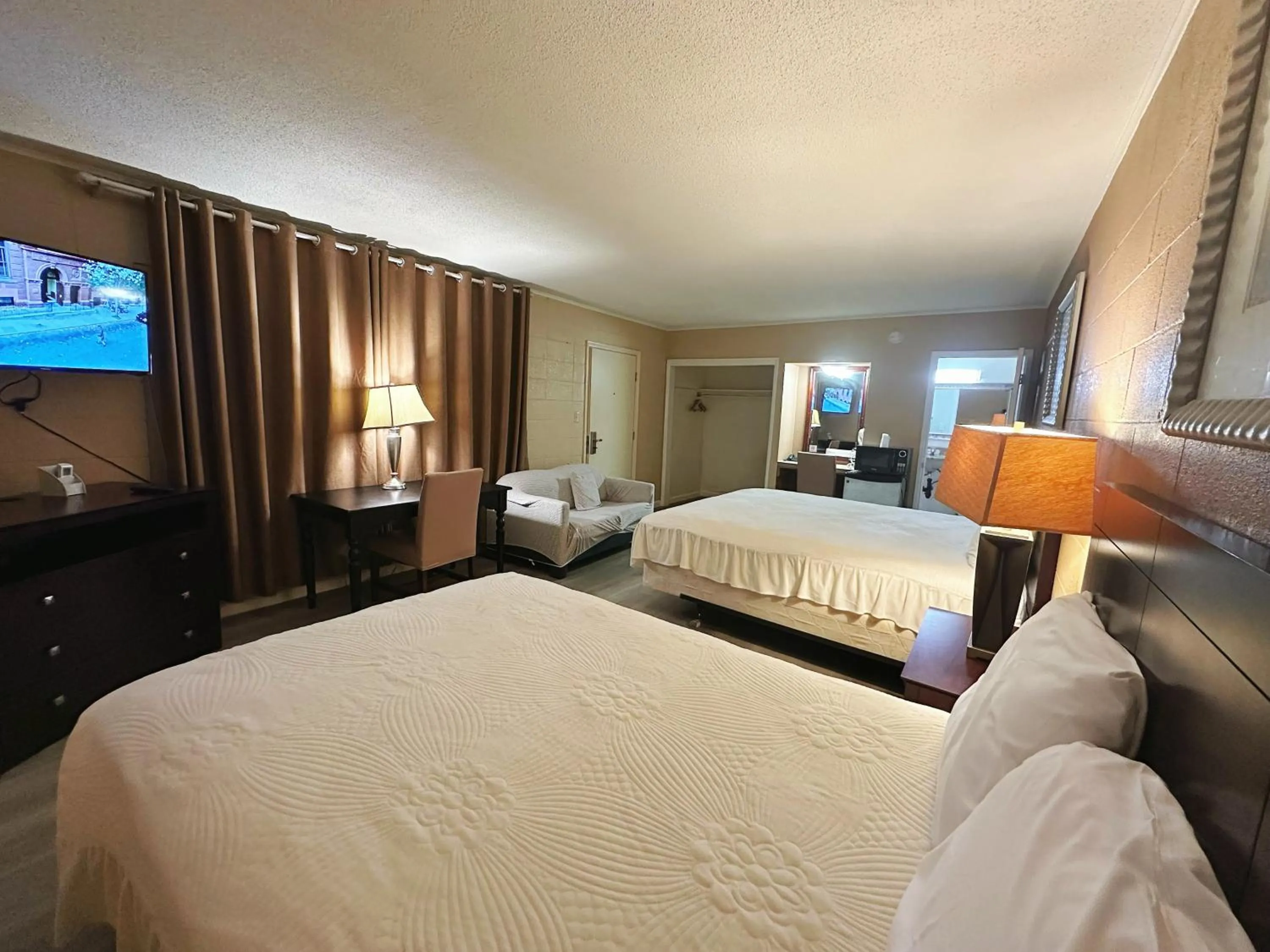 Bed in Royal Inn and Suites