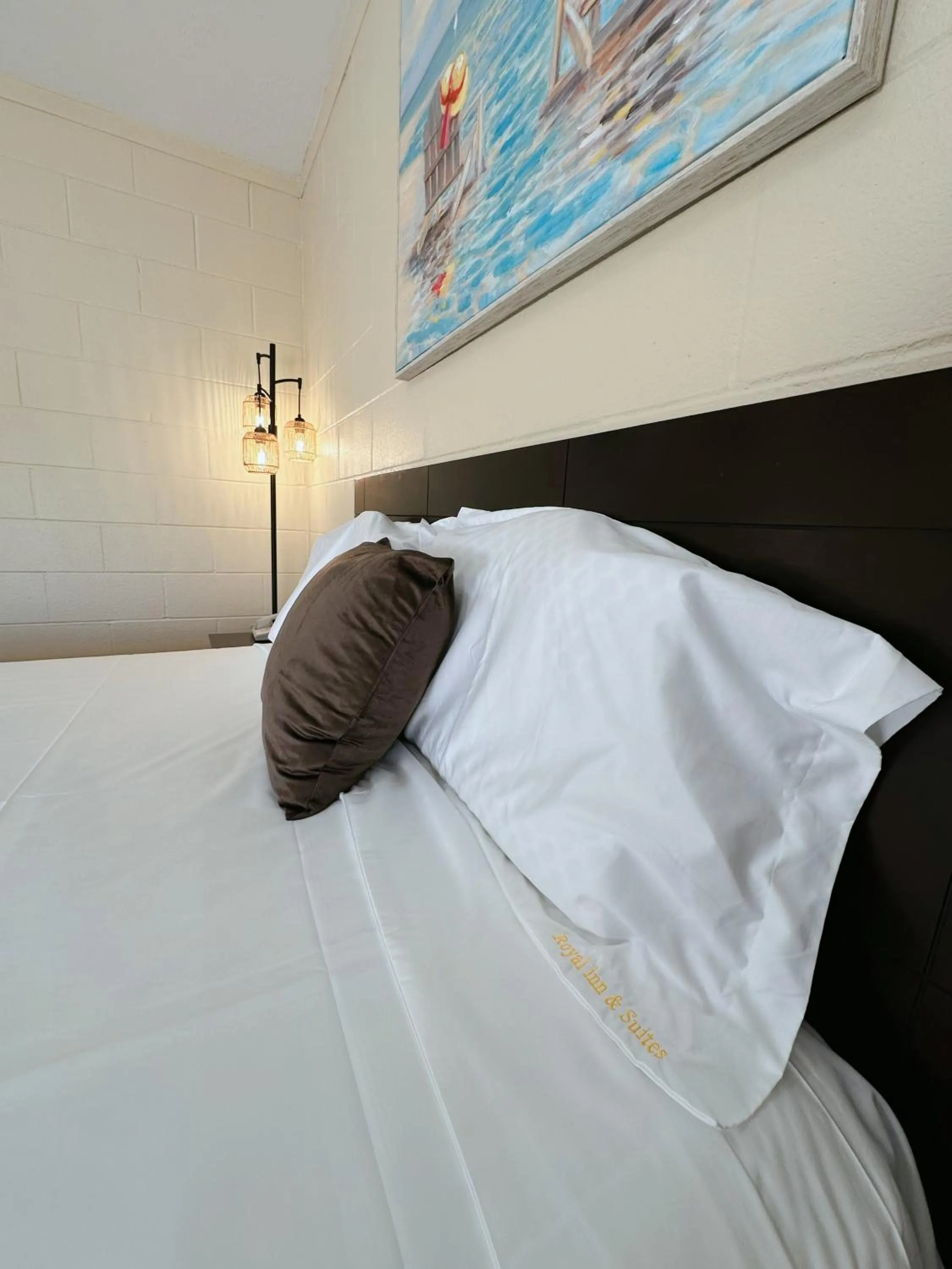 Bed in Royal Inn and Suites