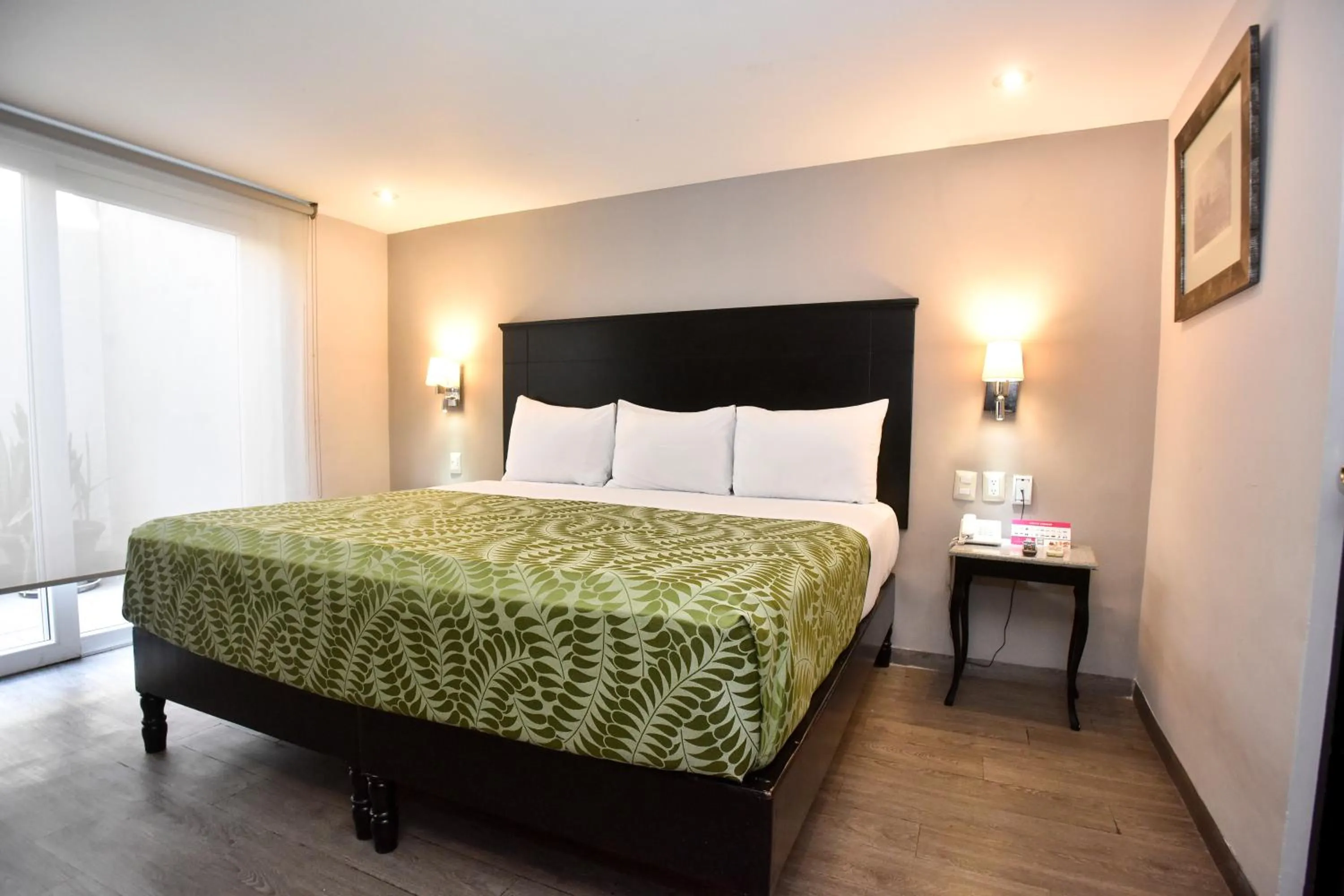 Bed in Plaza Camelinas Hotel