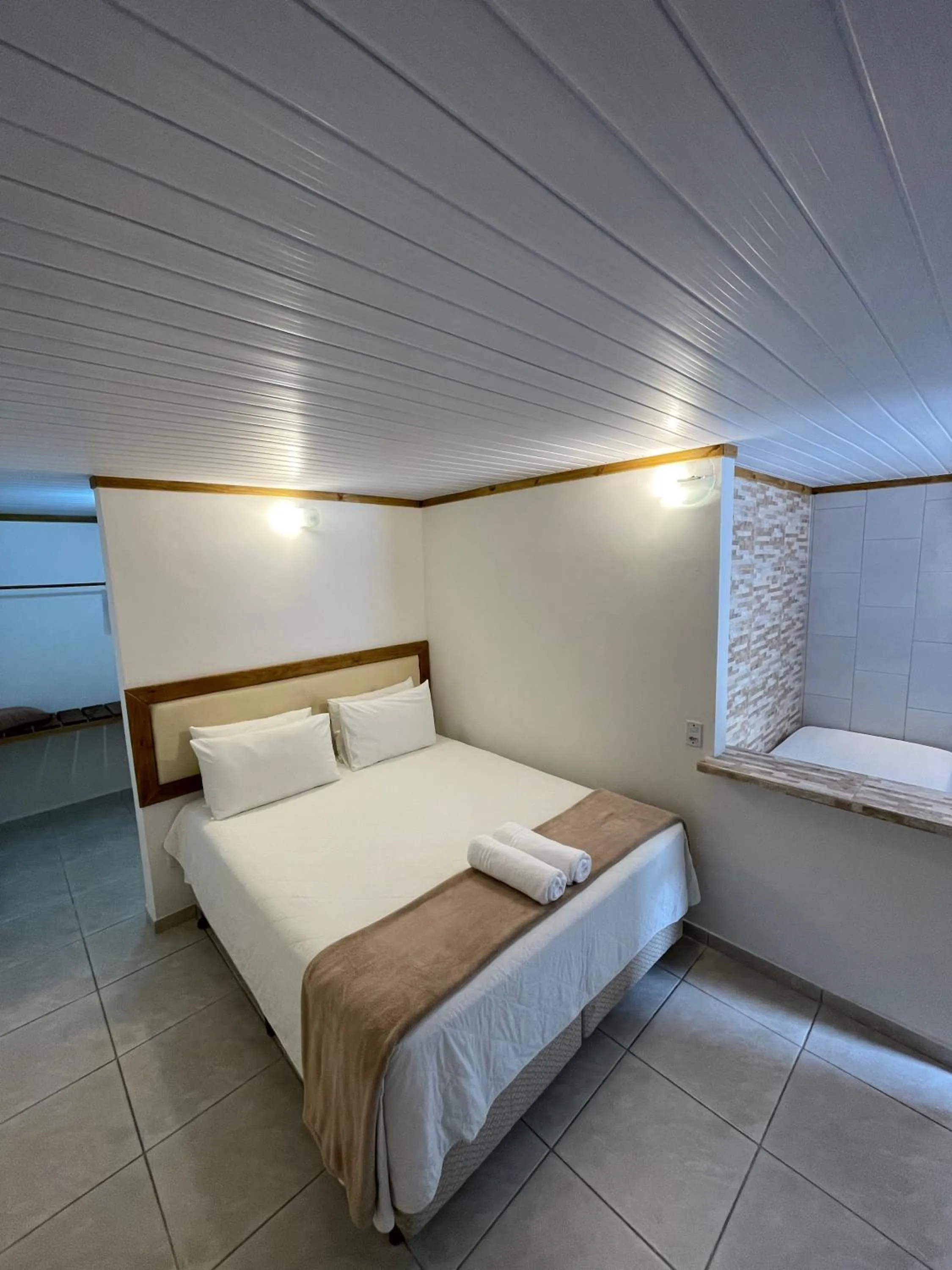 Bed in Pousada Ilha da Magia