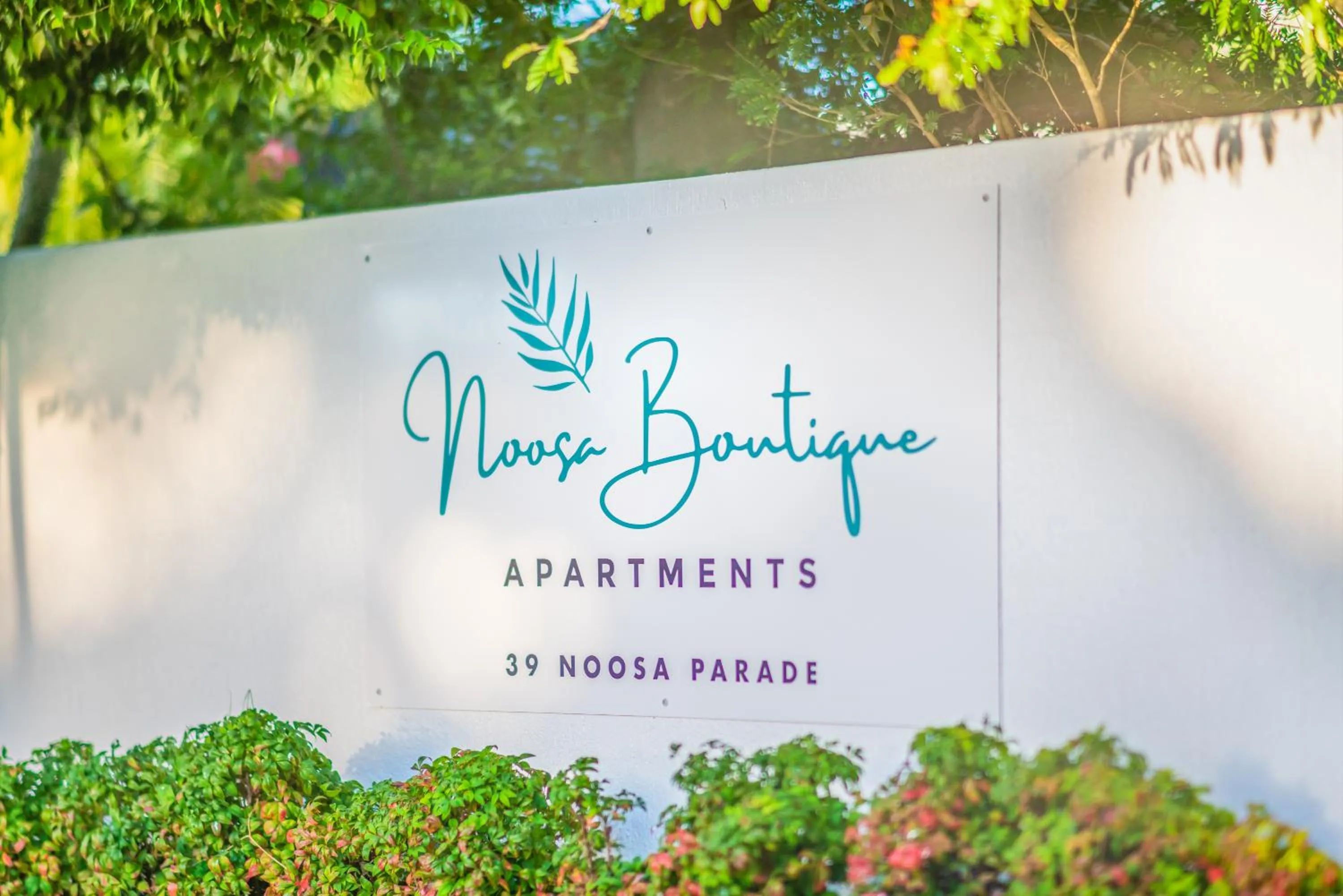 Property logo or sign in Noosa Boutique Apartments & Elkhorn Villas