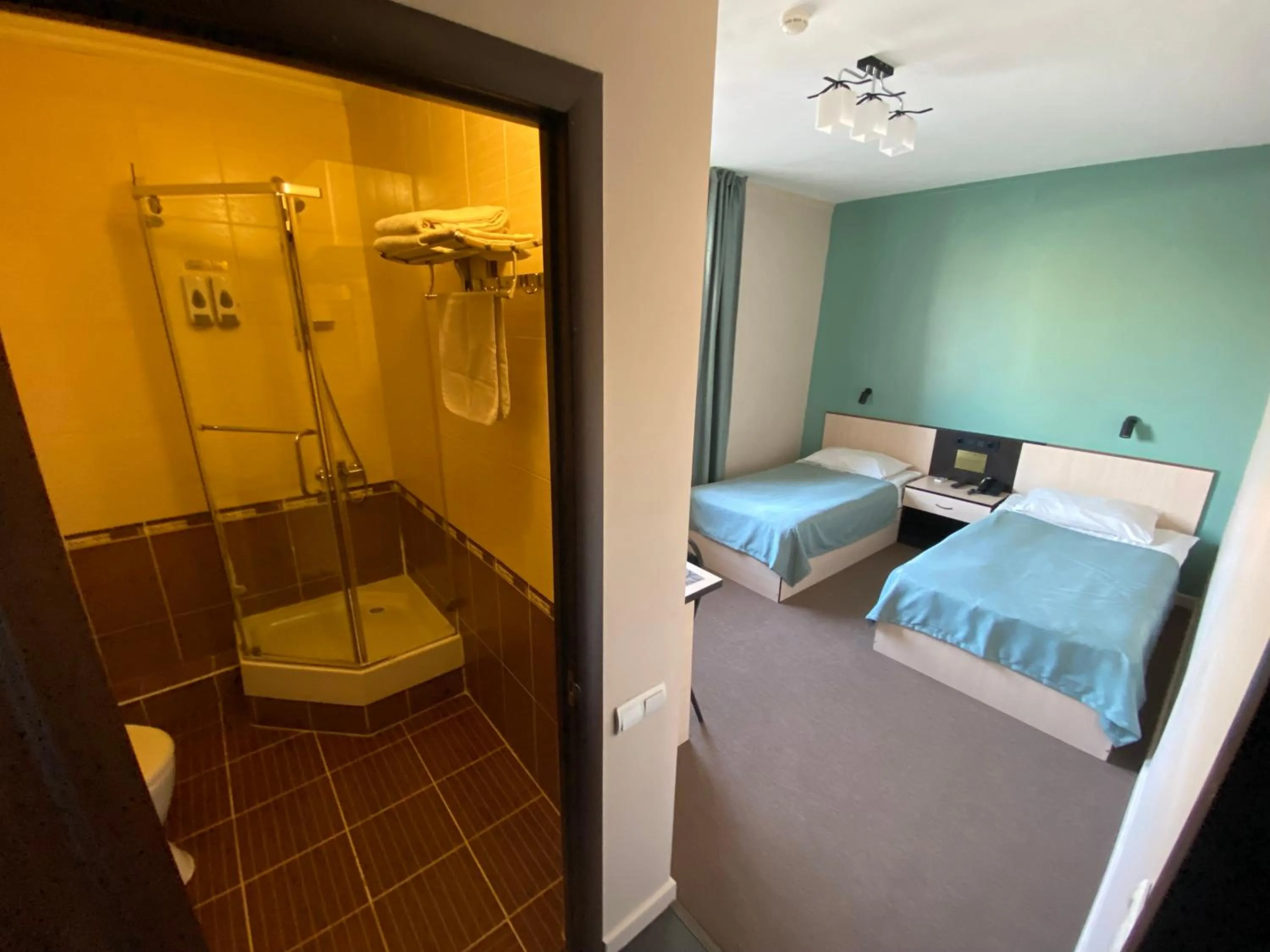 Shower, Bed in Ulpan Mini Hotel