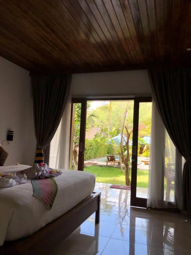 Bed in Crystal Bay Bungalows