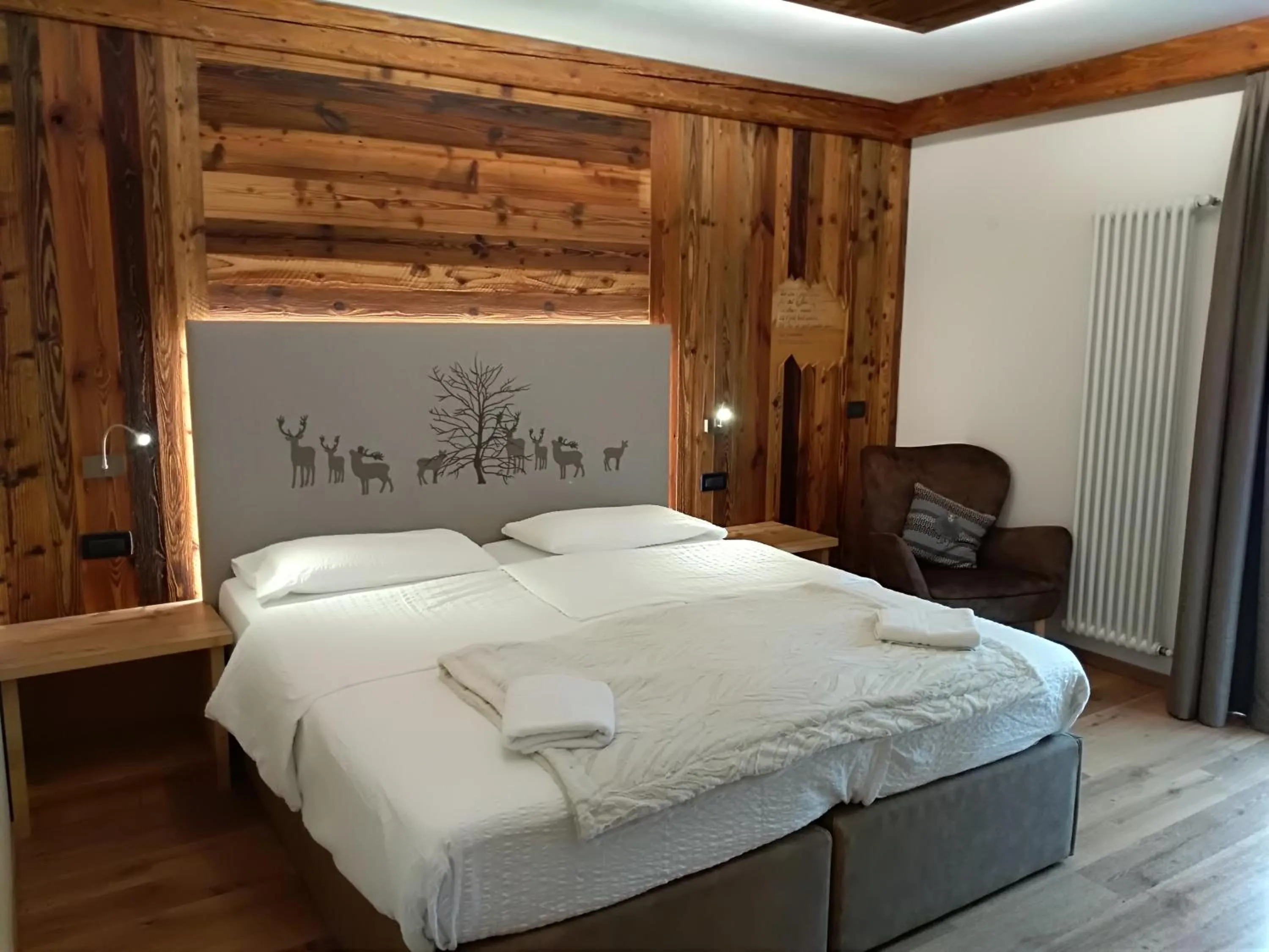 Bed in Garnì Prà Fiorì