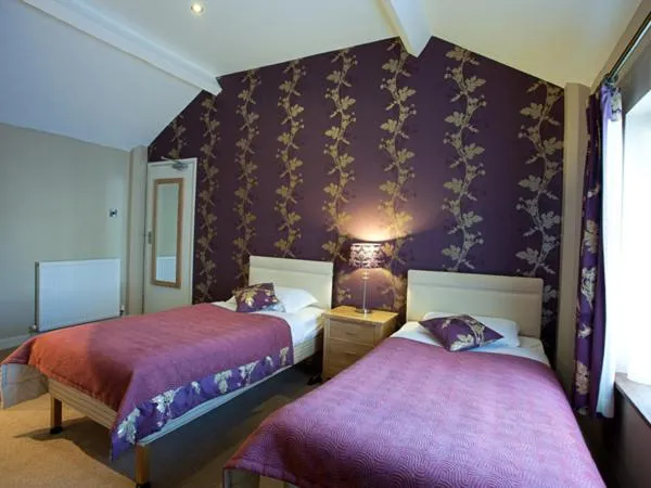 Photo of the whole room, Bed in The Carlton