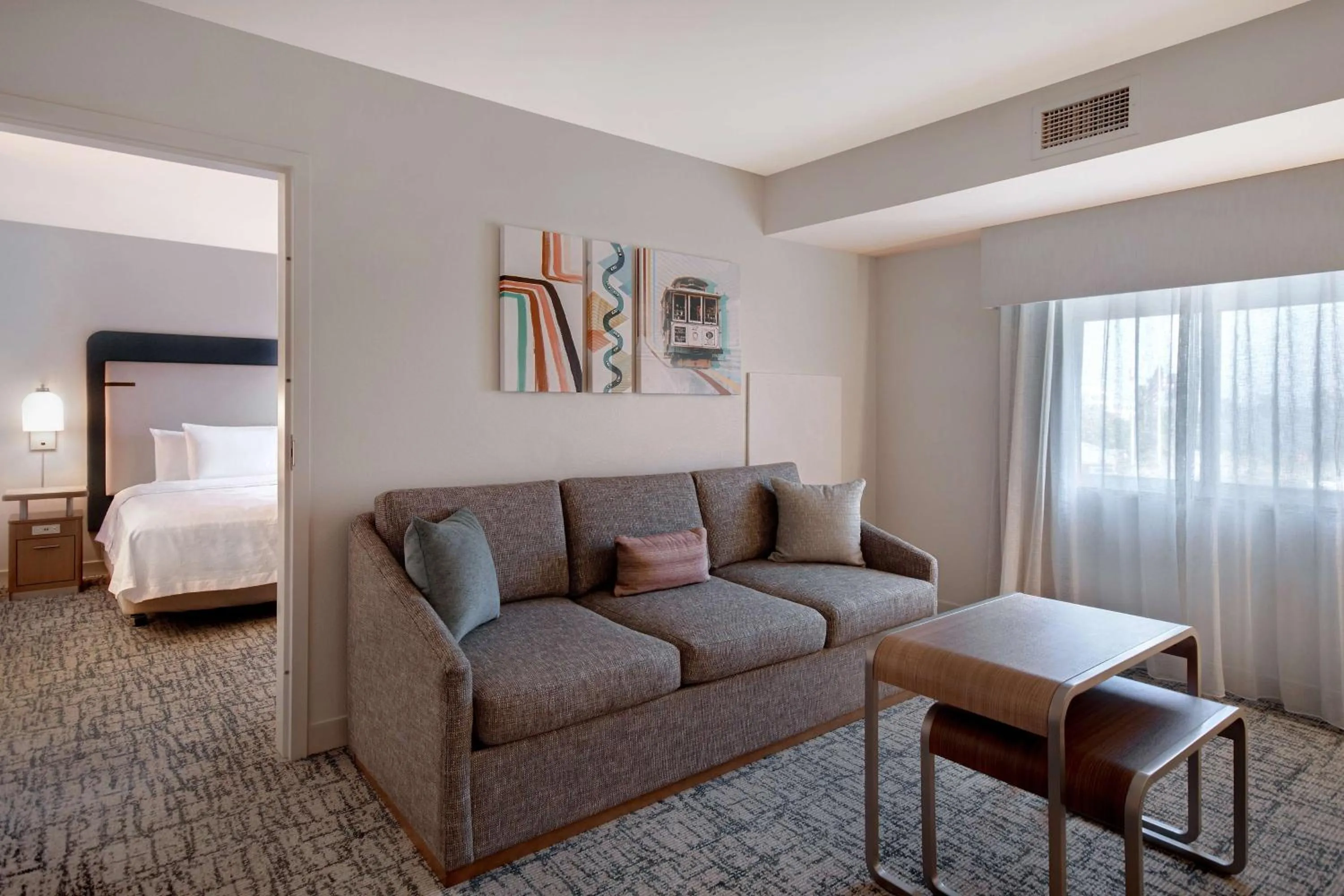 Living room, Bed in Homewood Suites by Hilton San Francisco Airport North California