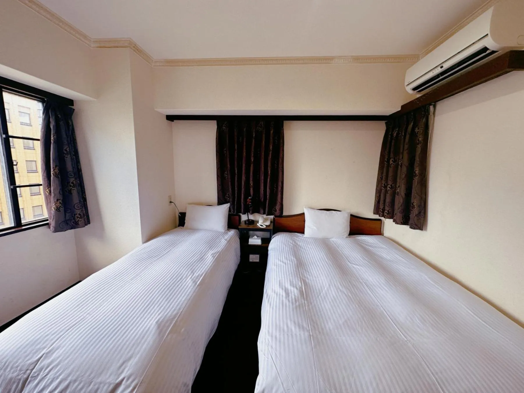 Photo of the whole room, Bed in Nissei Hotel Fukuoka