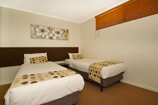 Bed in Mandurah Motel and Apartments