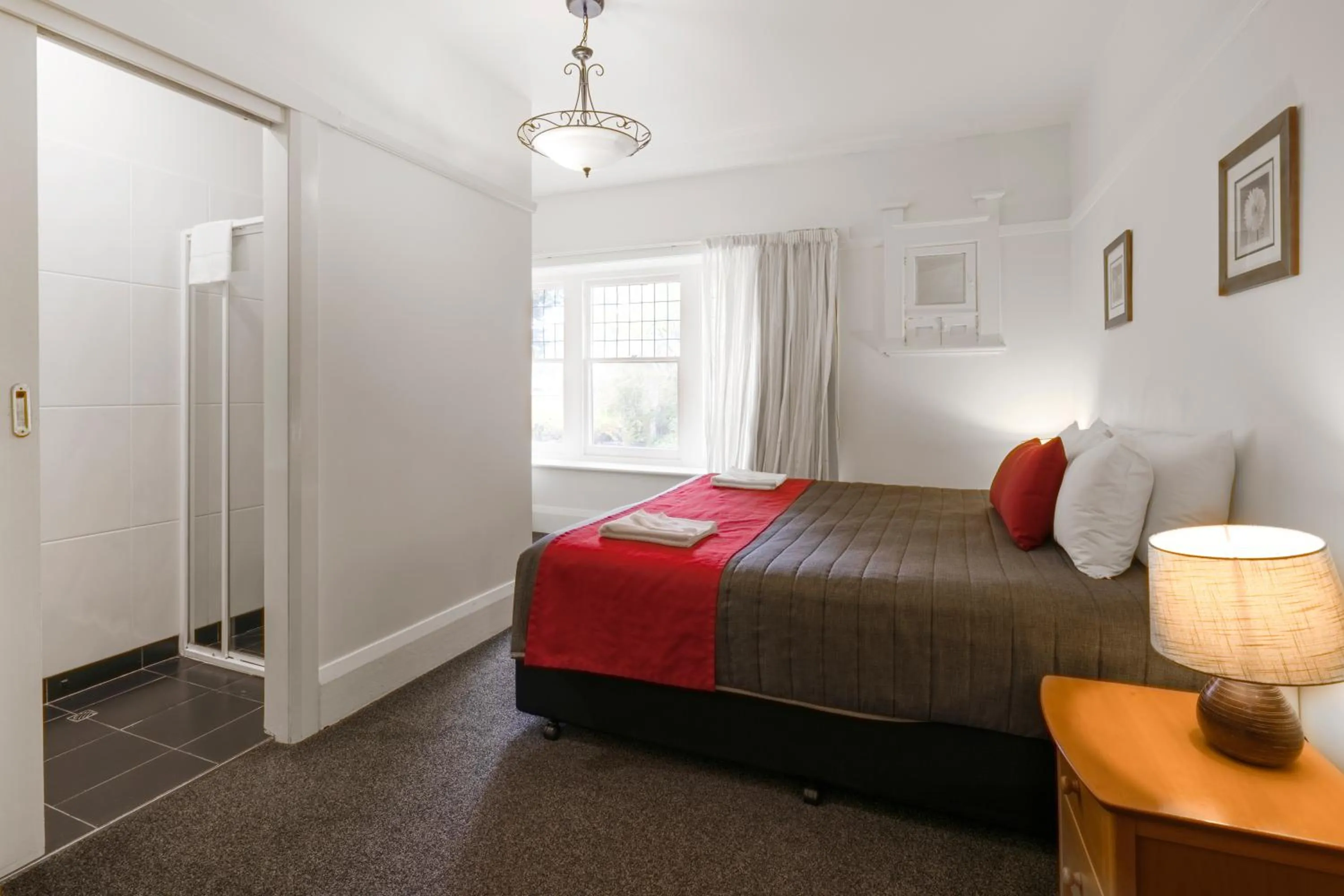 Shower, Bed in Graham Apartments