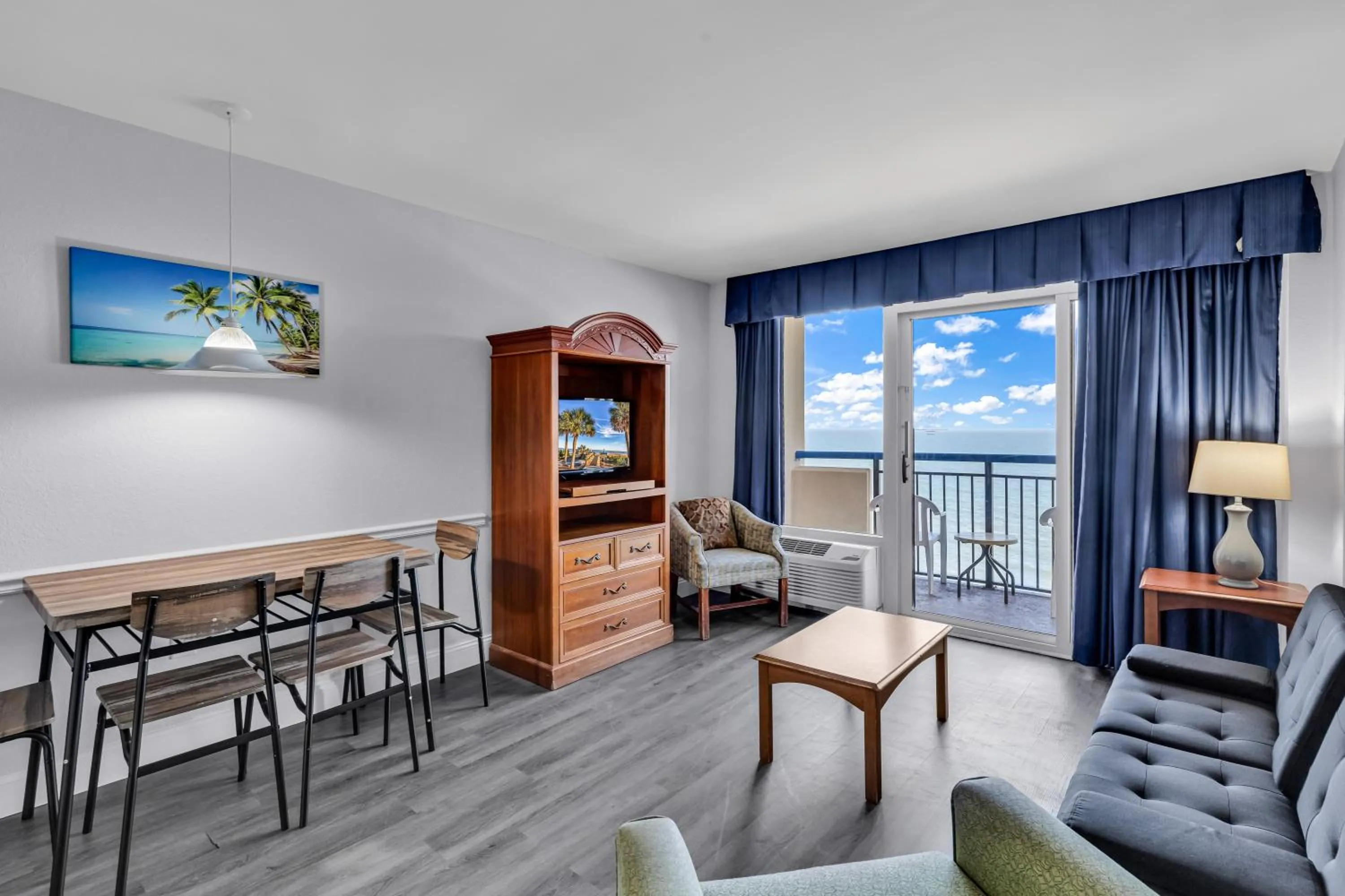 Living room in Boardwalk Beach Resort Condo w Oceanfront Balcony