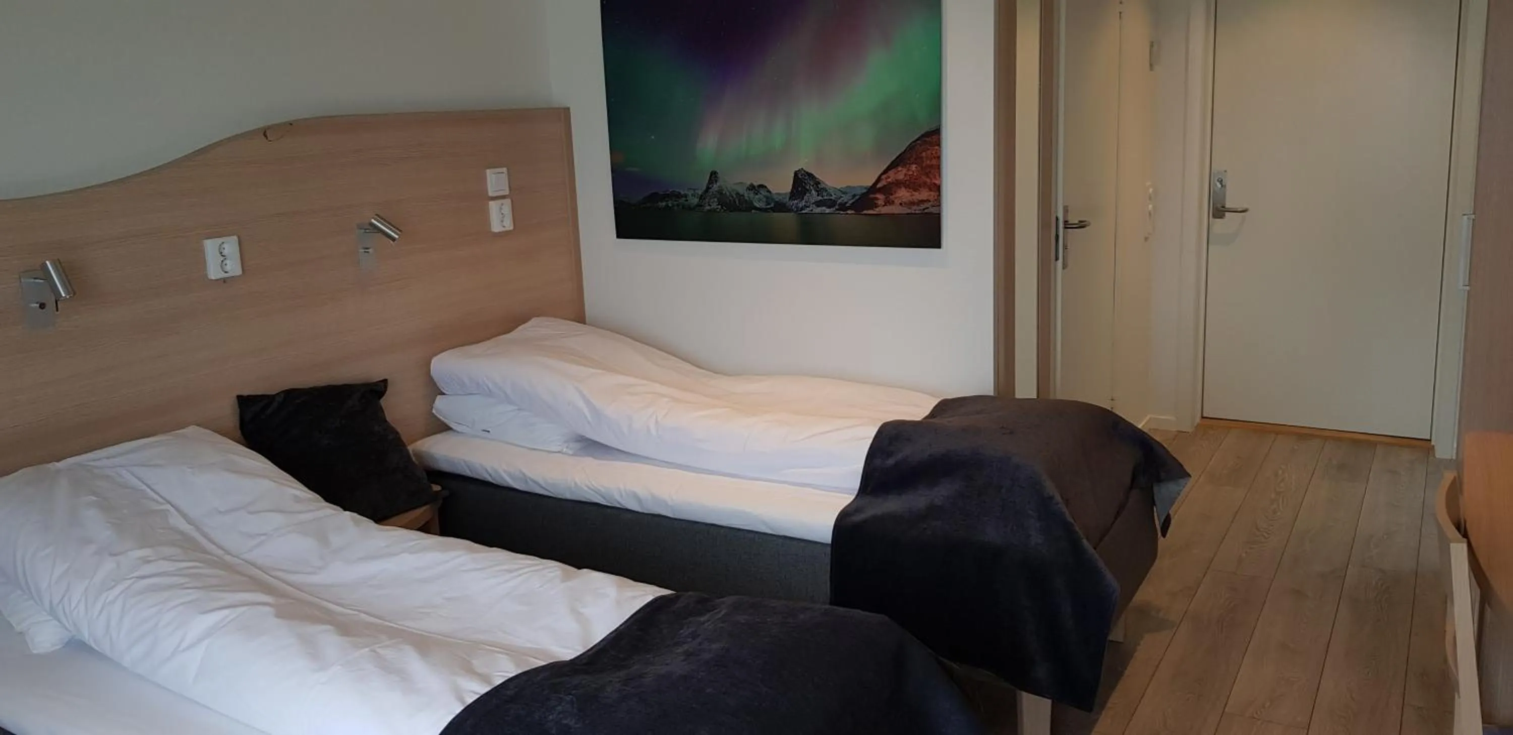 Bed in Senja Fjordhotell and Apartments