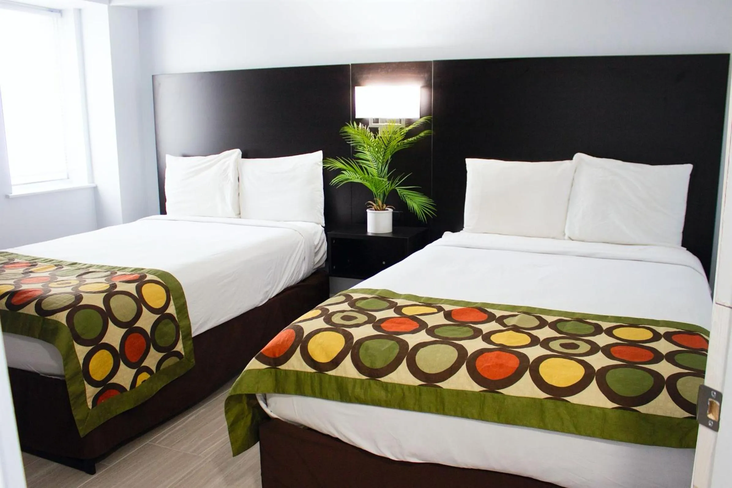 Bed in Sun & Sand Resort Oceanfront Suites
