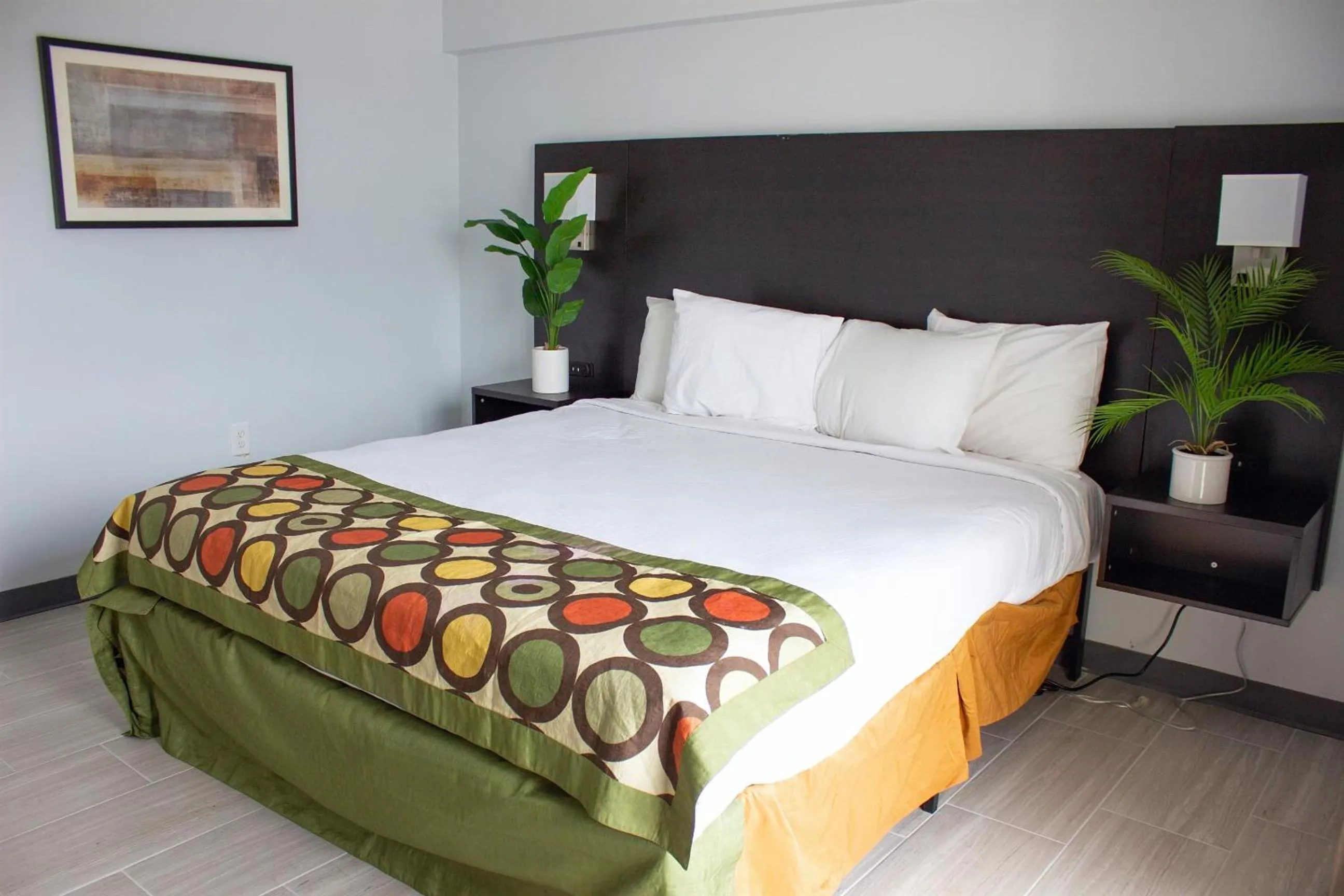 Bed in Sun & Sand Resort Oceanfront Suites