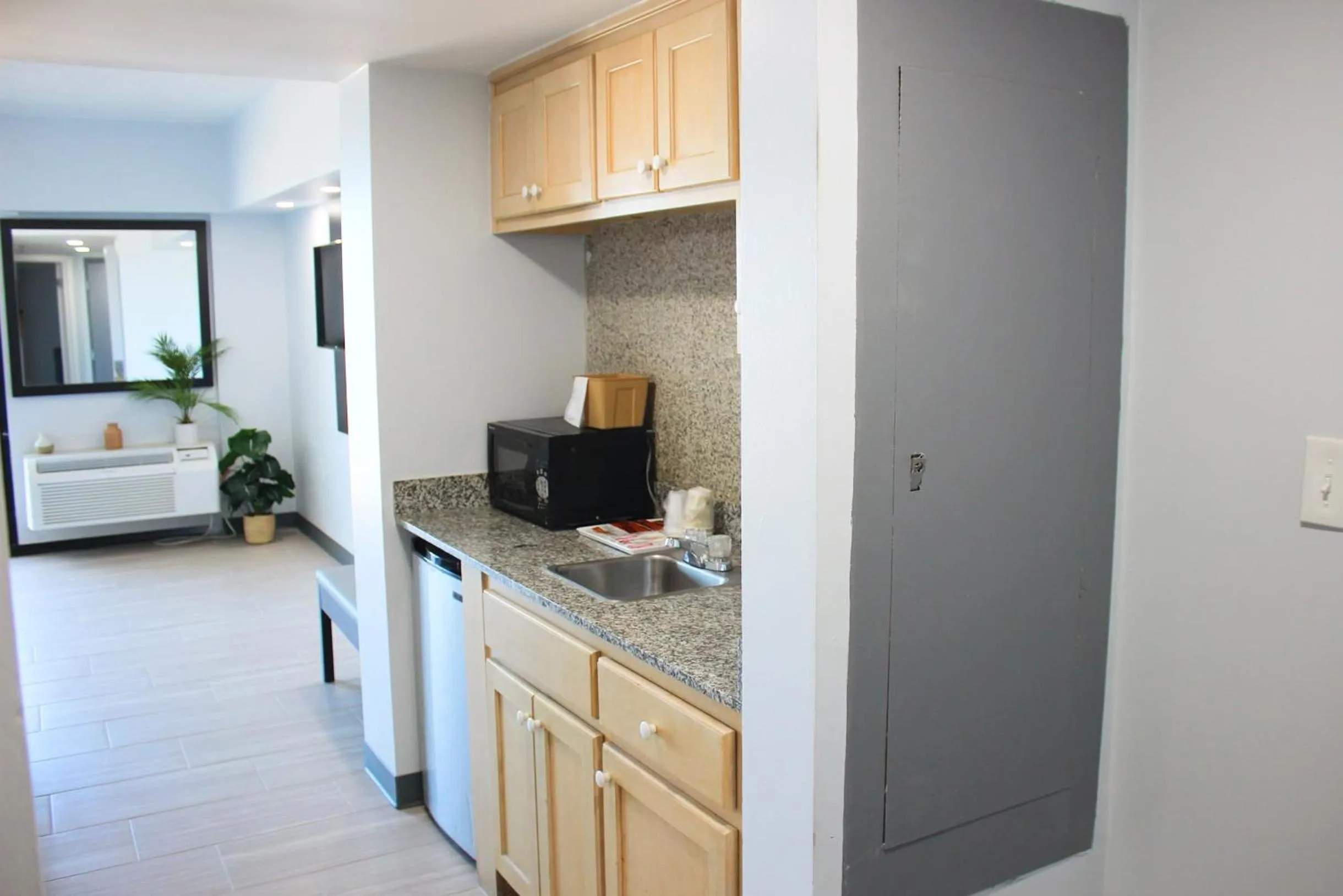 Kitchen or kitchenette in Sun & Sand Resort Oceanfront Suites