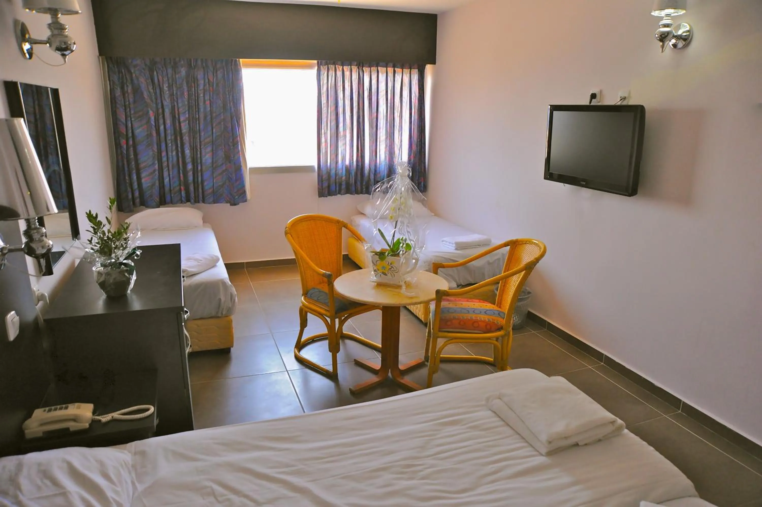 Photo of the whole room, TV/Entertainment Center in Aquamarine Hotel