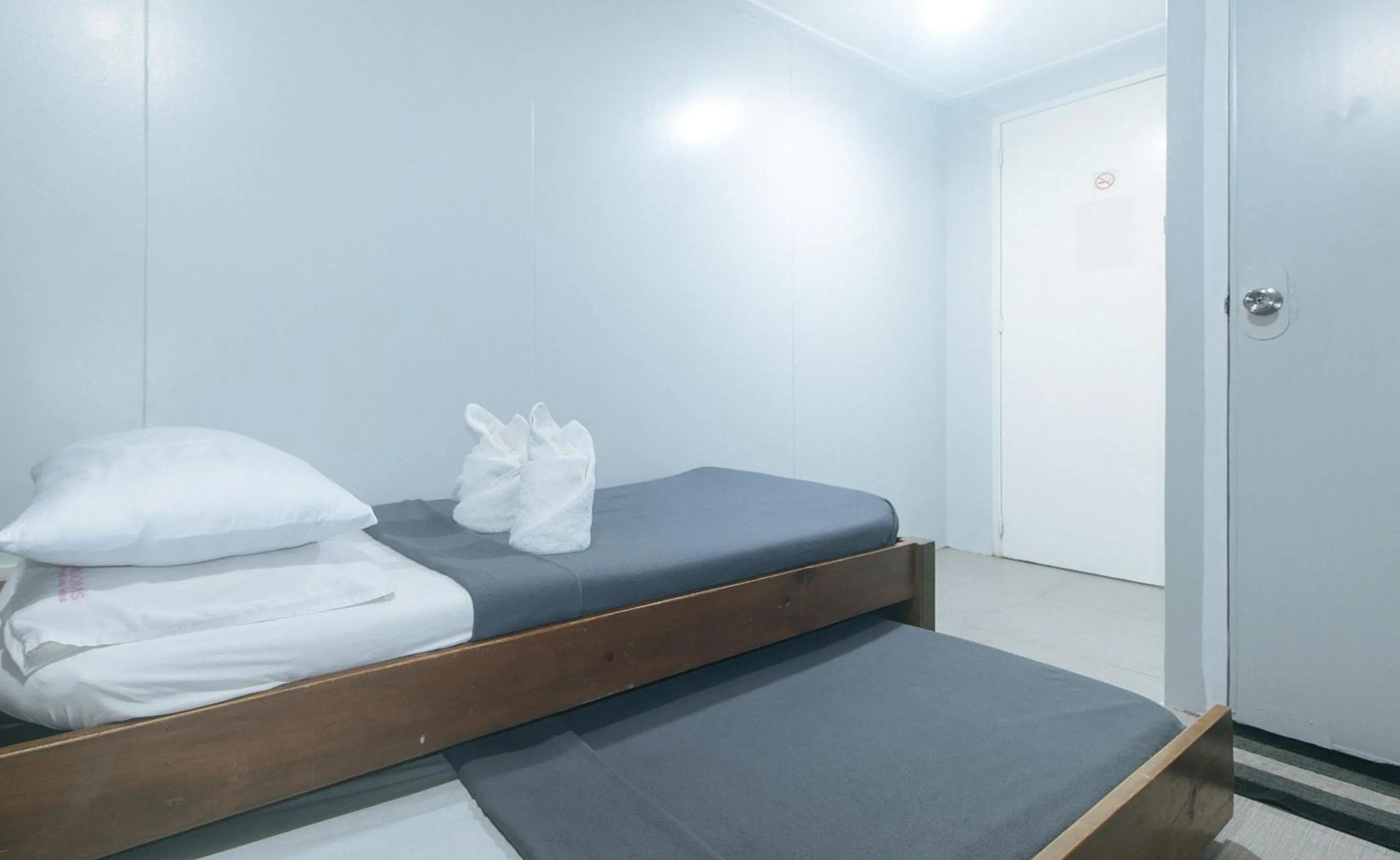 Bed in Metro Deluxe Residences near World Trade Center