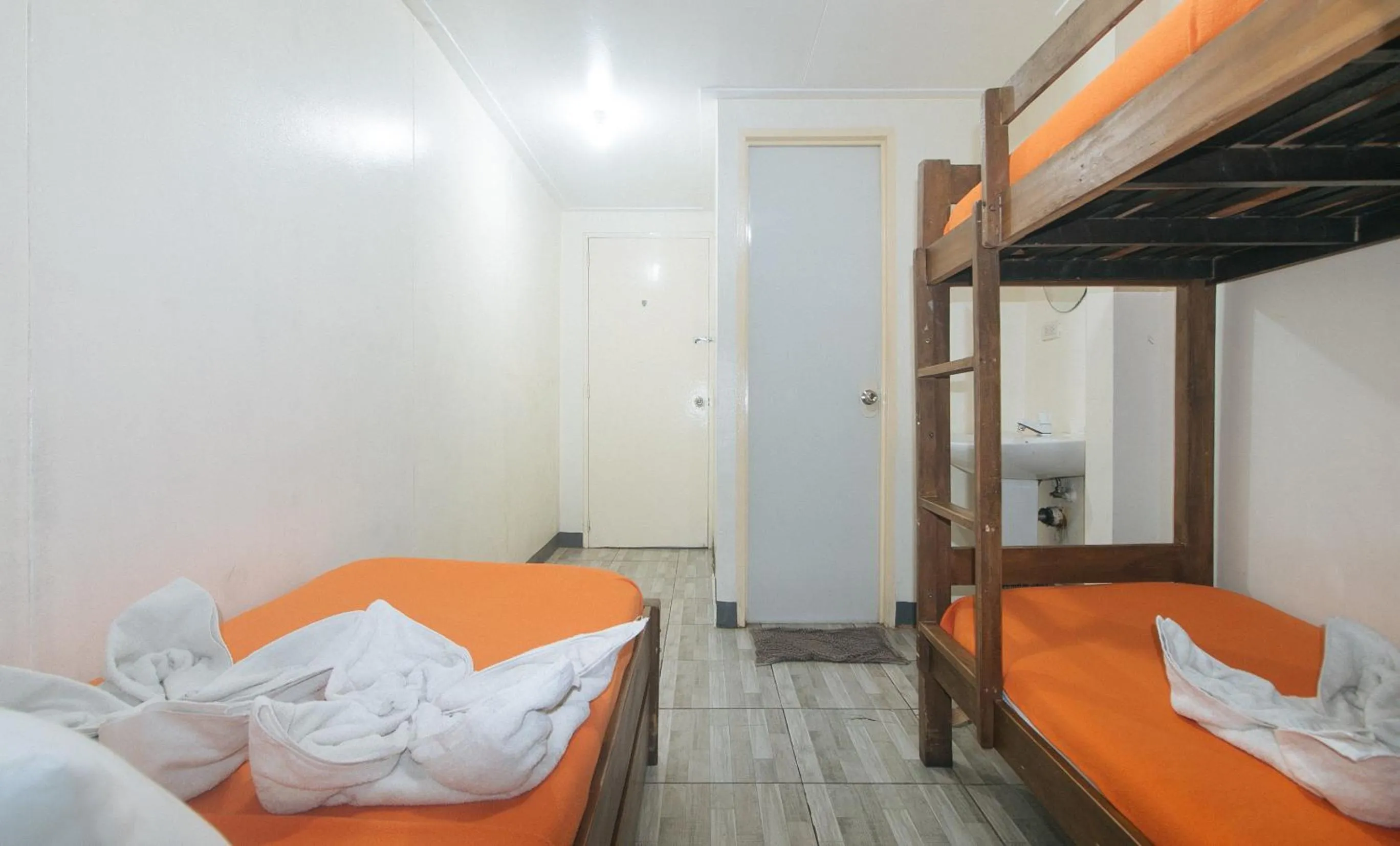 Bed in Metro Deluxe Residences near World Trade Center