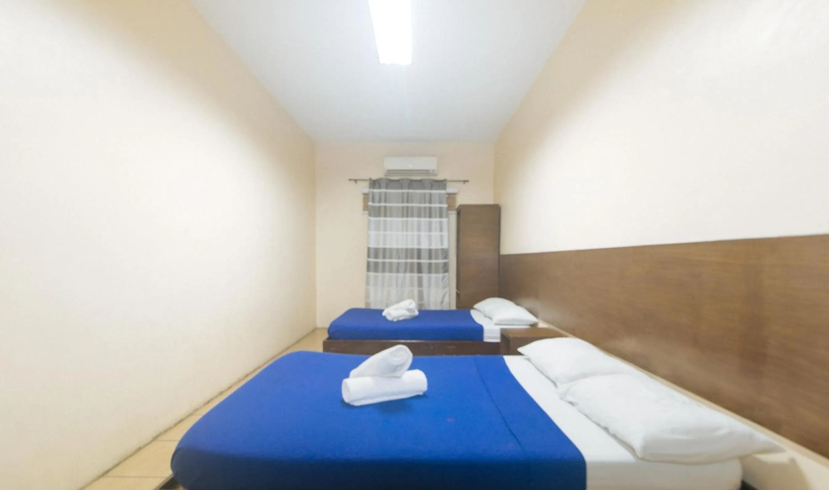 Bed in Metro Deluxe Residences near World Trade Center