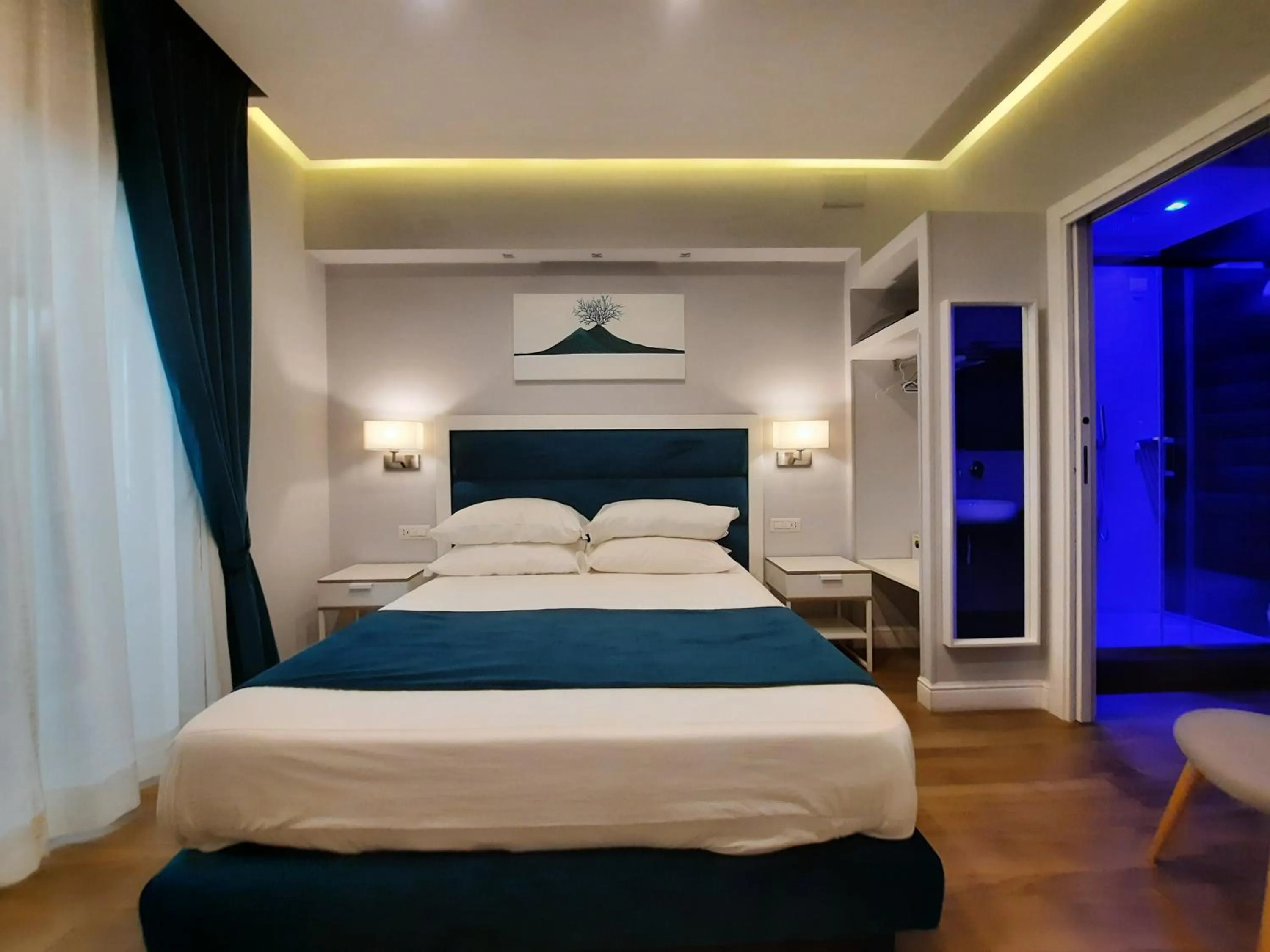 Photo of the whole room, Bed in Gea suite