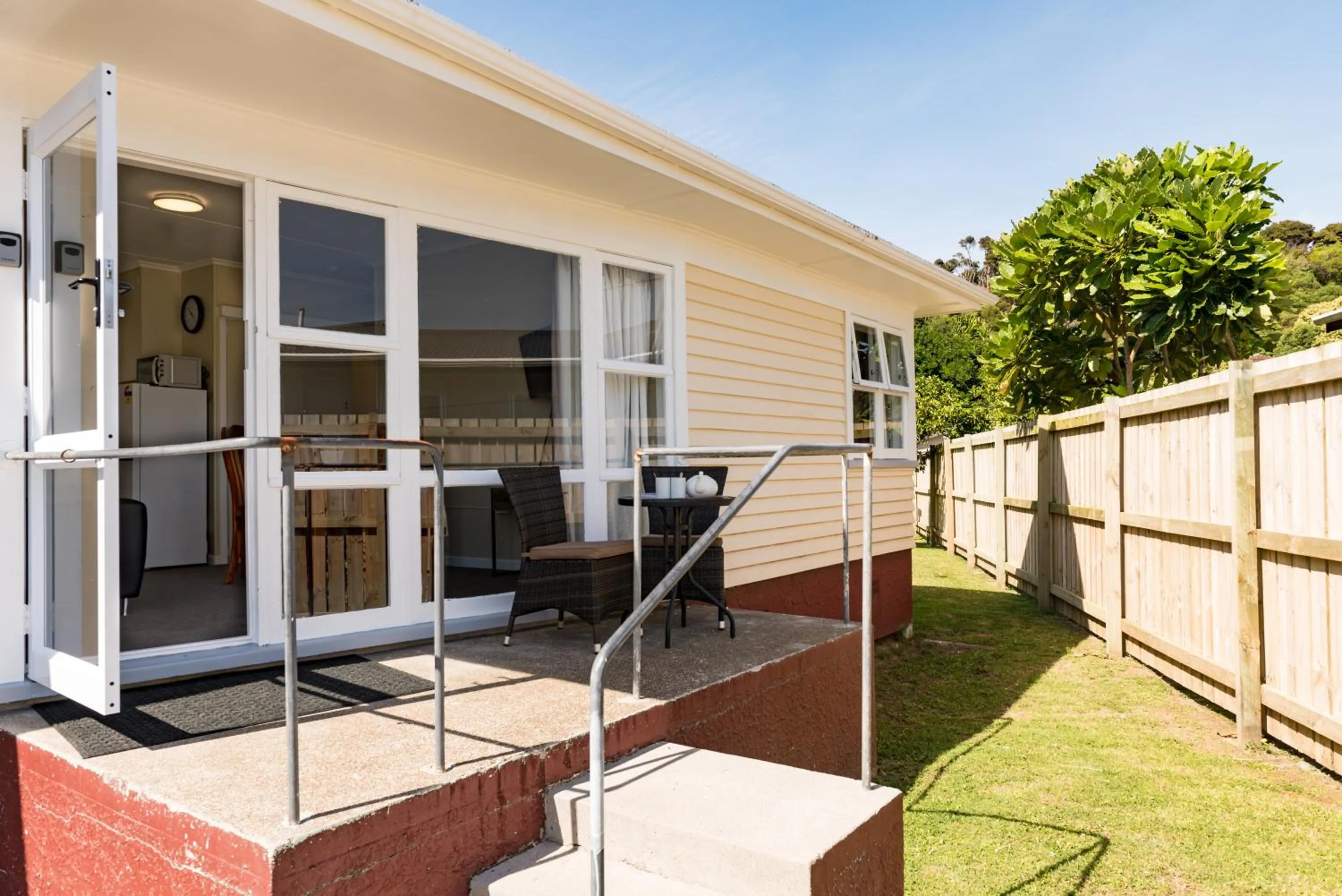 Facade/entrance in Waitangi Beach Bach 30B