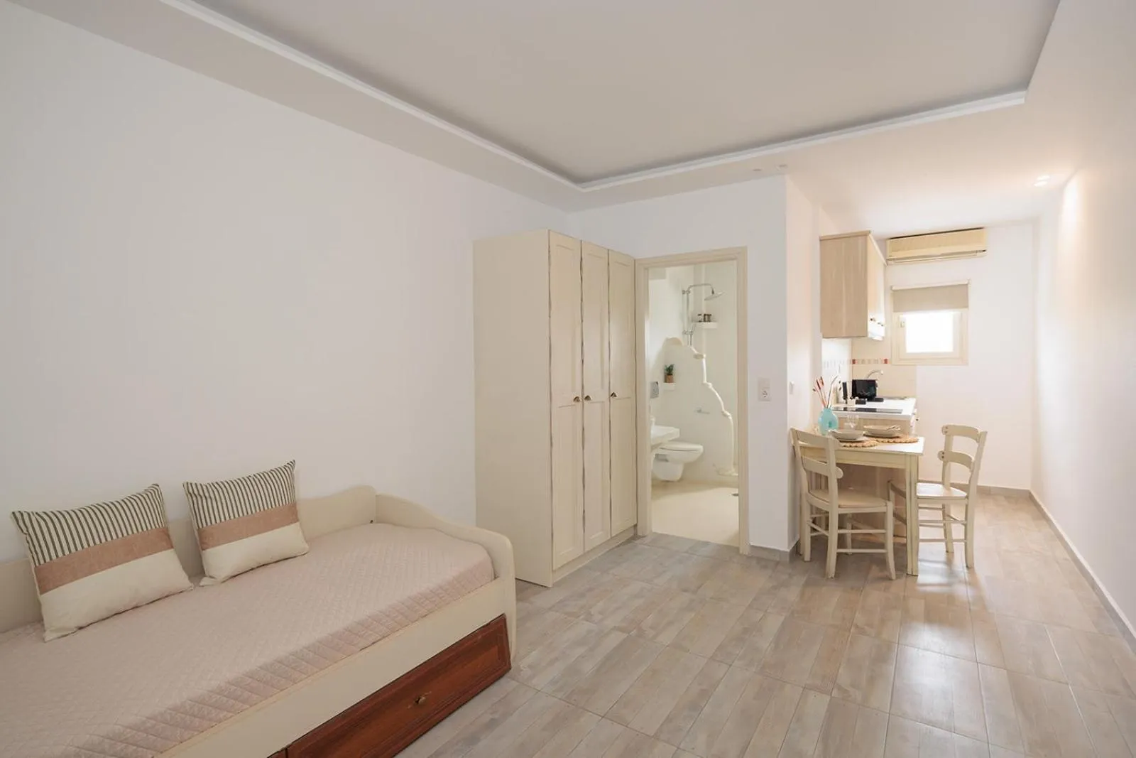 Seating area, Bed in Anemomilos Beach hotel