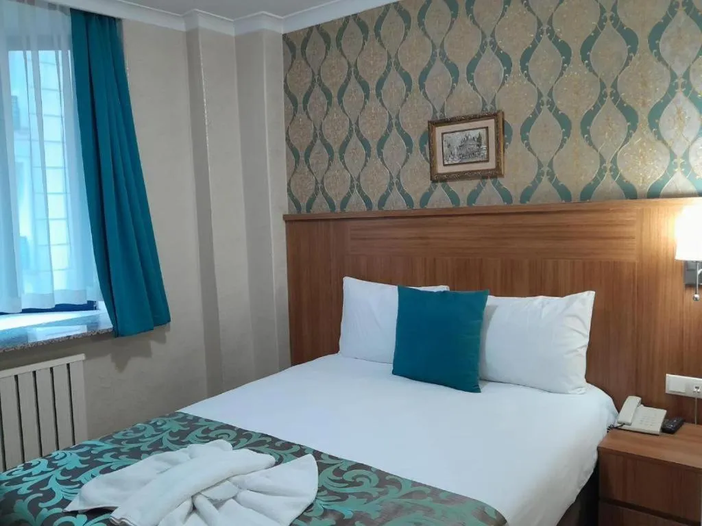 Bed in Grand Dilara Hotel