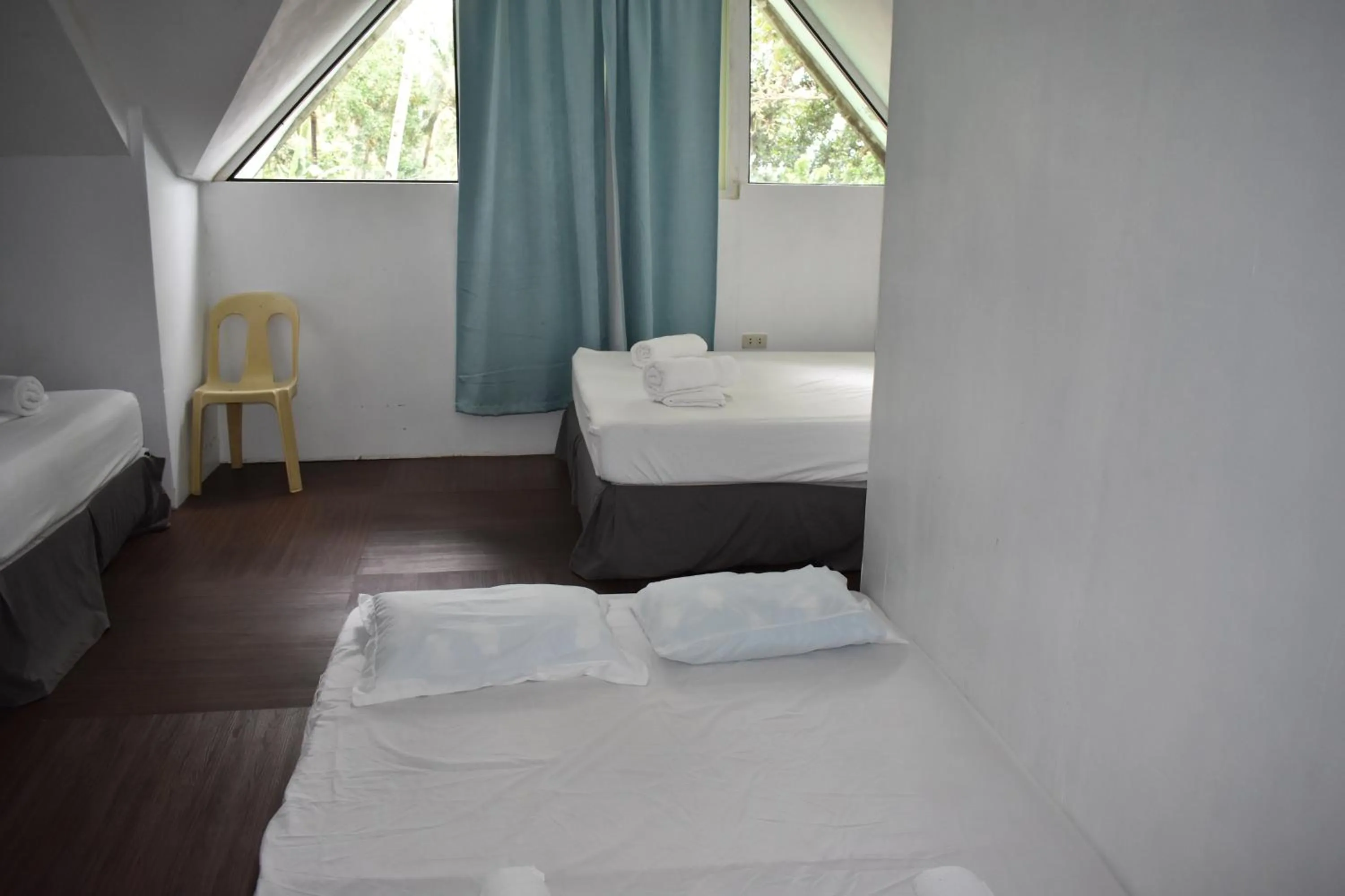 Bedroom, Bed in Seaside traveler's Inn by Camiguin Island Home