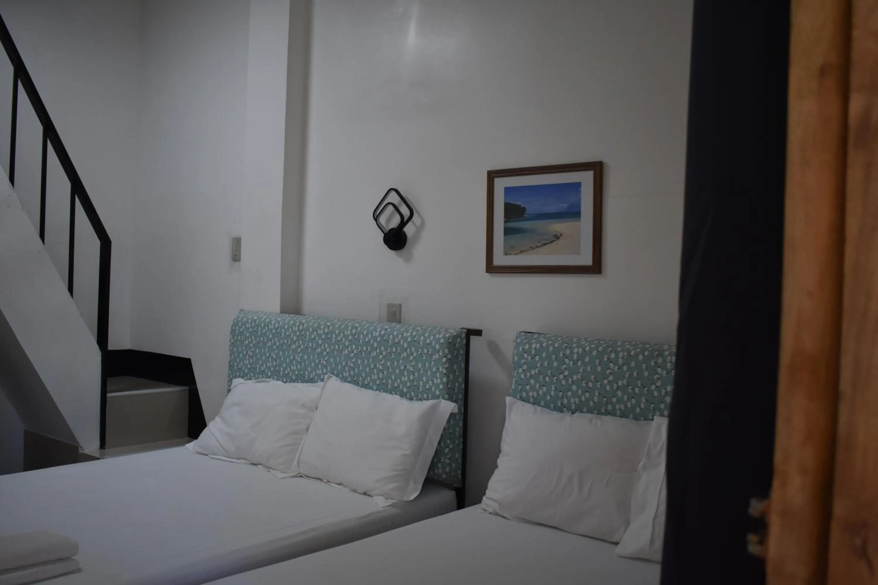 Bedroom, Bed in Seaside traveler's Inn by Camiguin Island Home