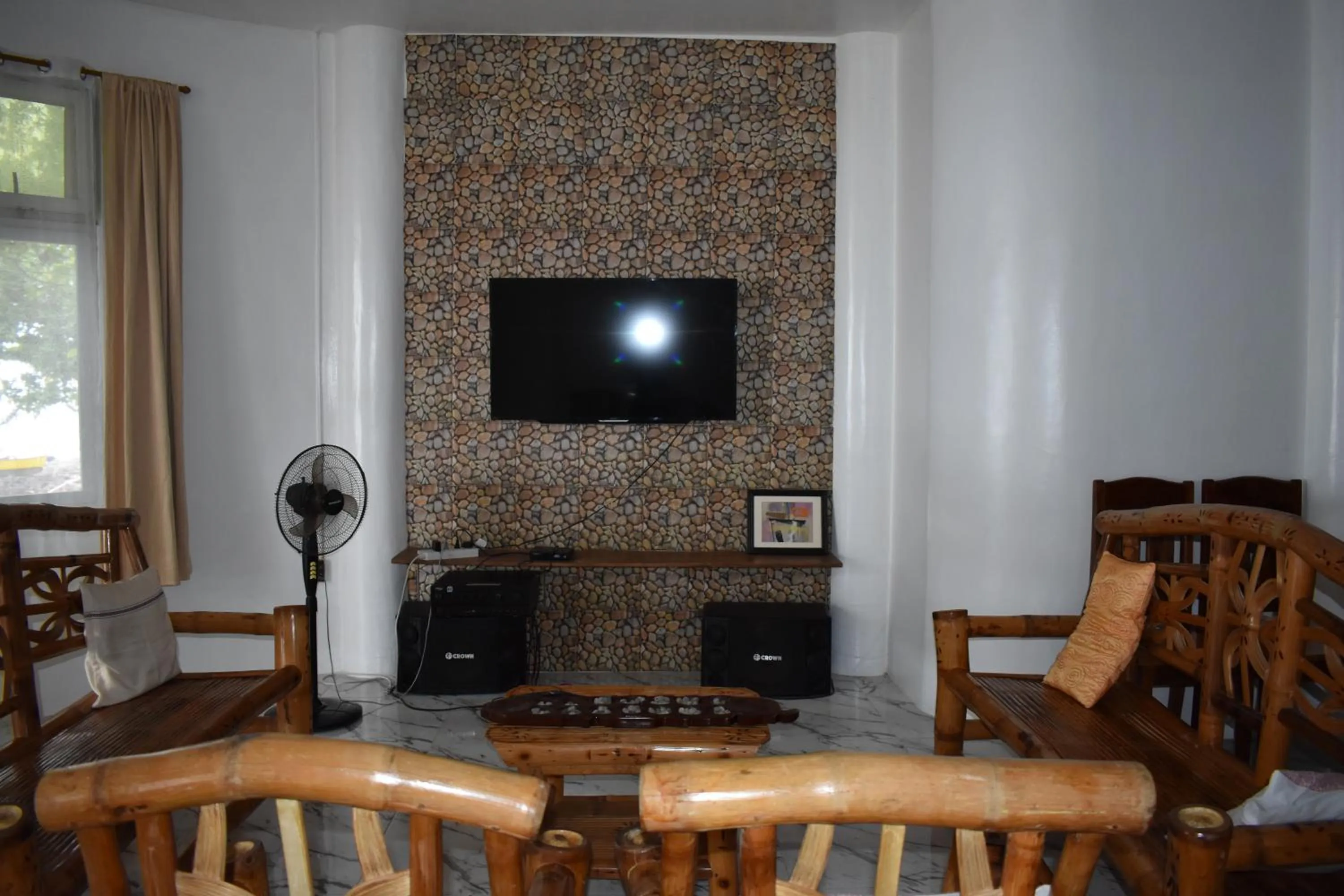 Living room in Seaside traveler's Inn by Camiguin Island Home