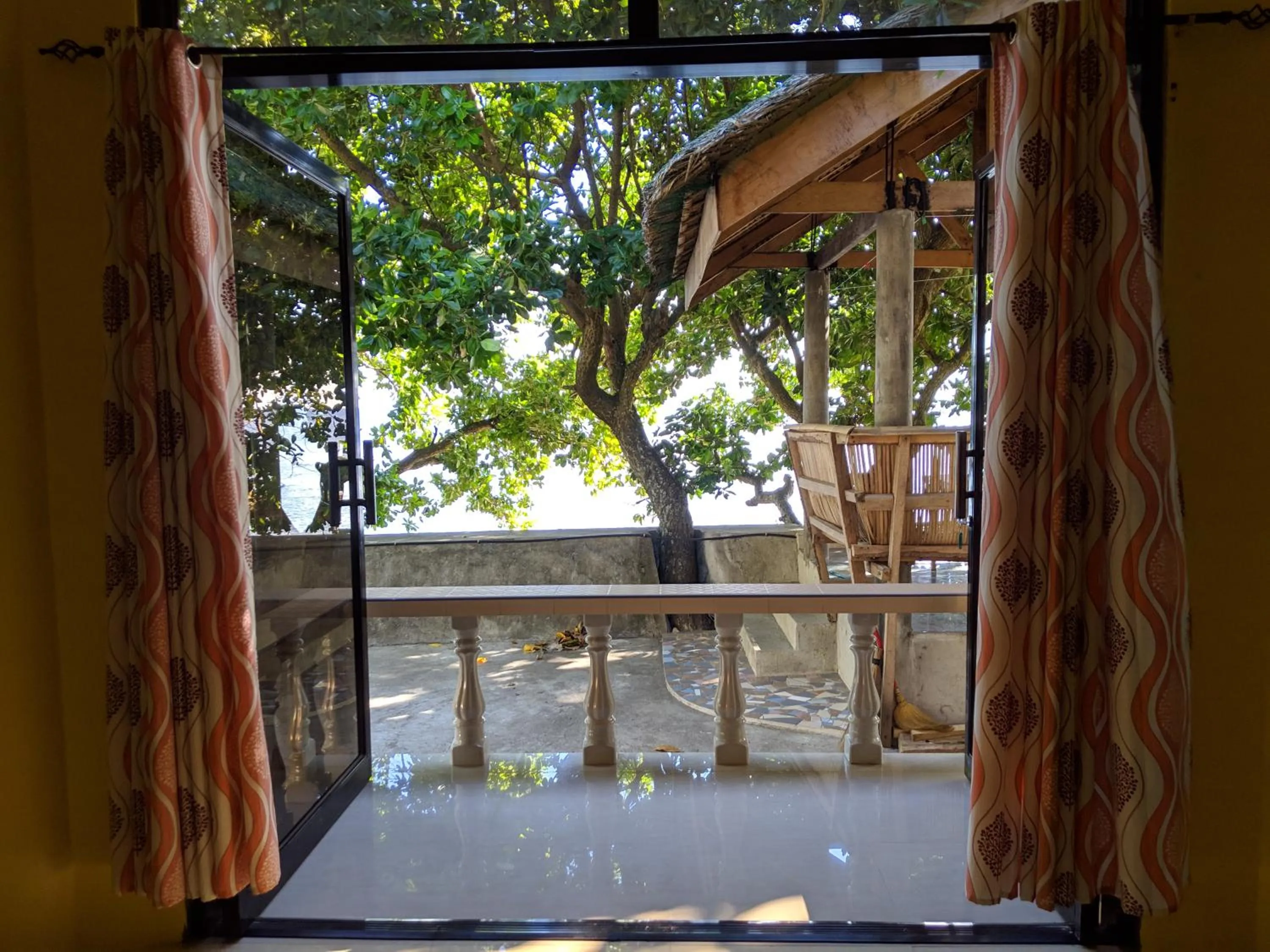 Balcony/Terrace in Seaside traveler's Inn by Camiguin Island Home