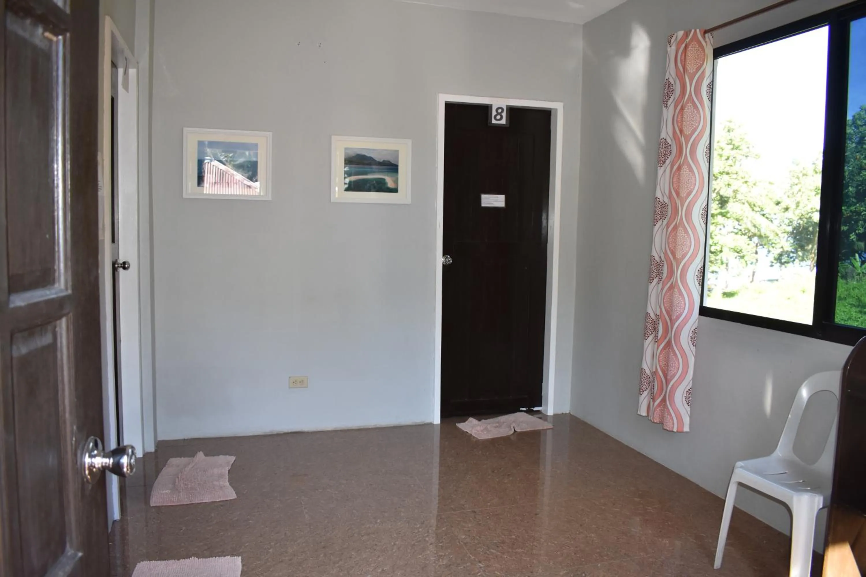 Living room in Seaside traveler's Inn by Camiguin Island Home