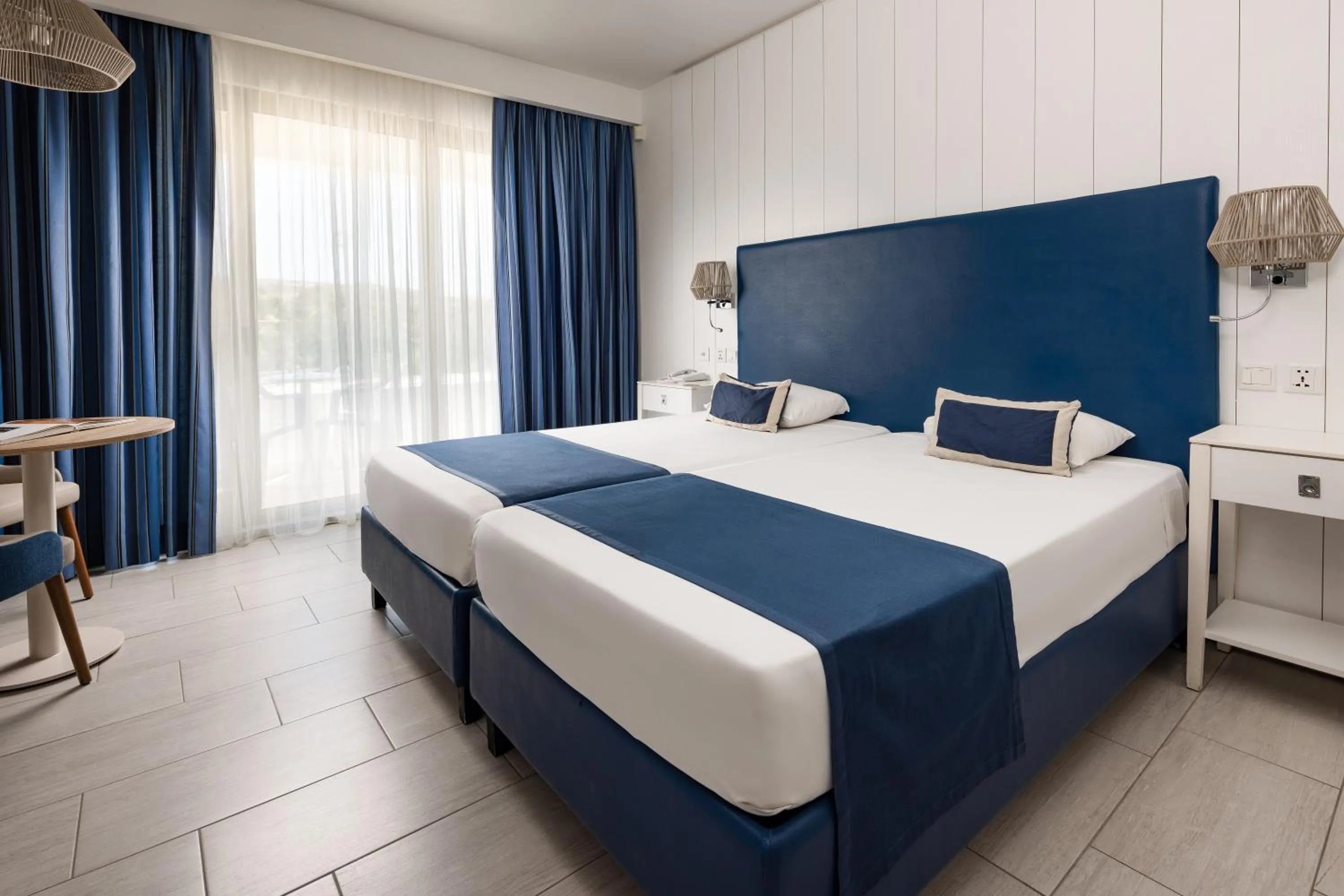 Bed in db Seabank Resort + Spa All Inclusive