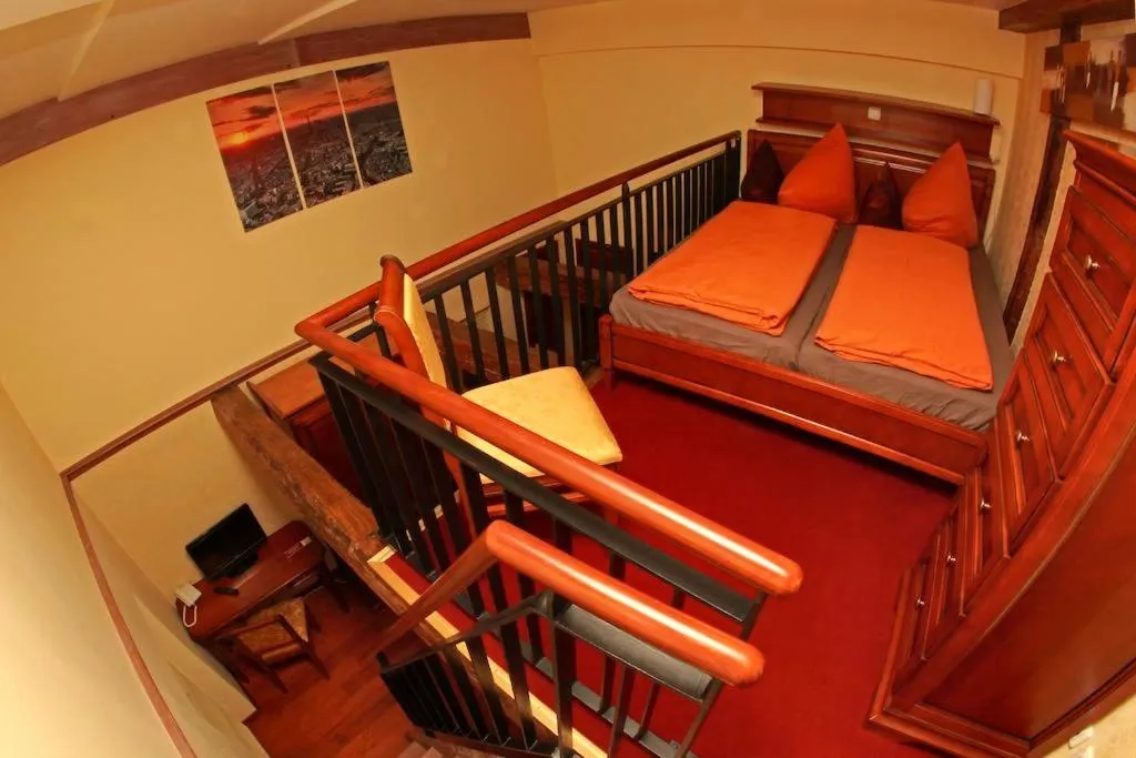 Photo of the whole room, Bed in Hotel Denkmal 13 Rostock - Kaufmannshaus Krahnstöver