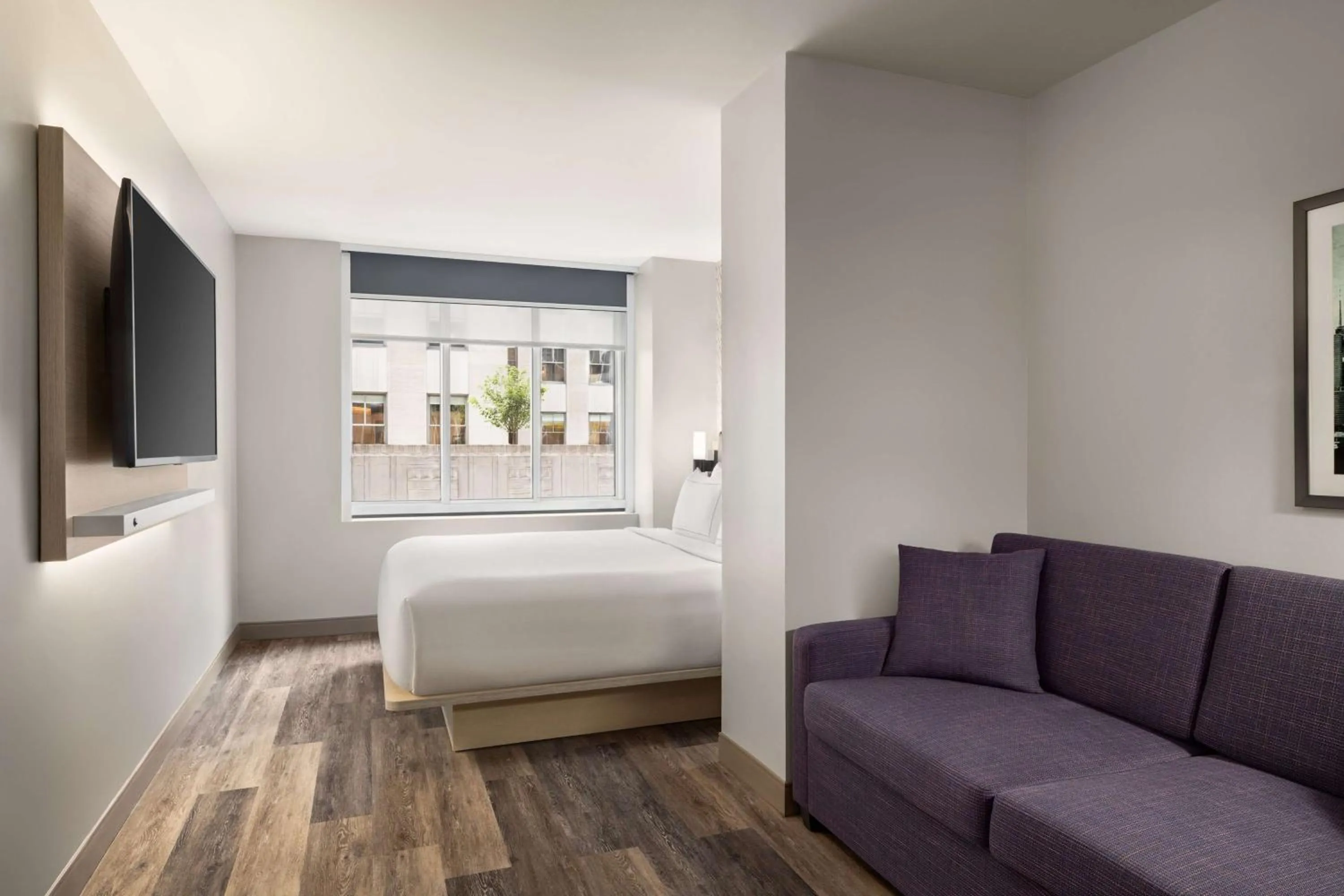 Living room, Bed in DoubleTree by Hilton New York Midtown Fifth Ave