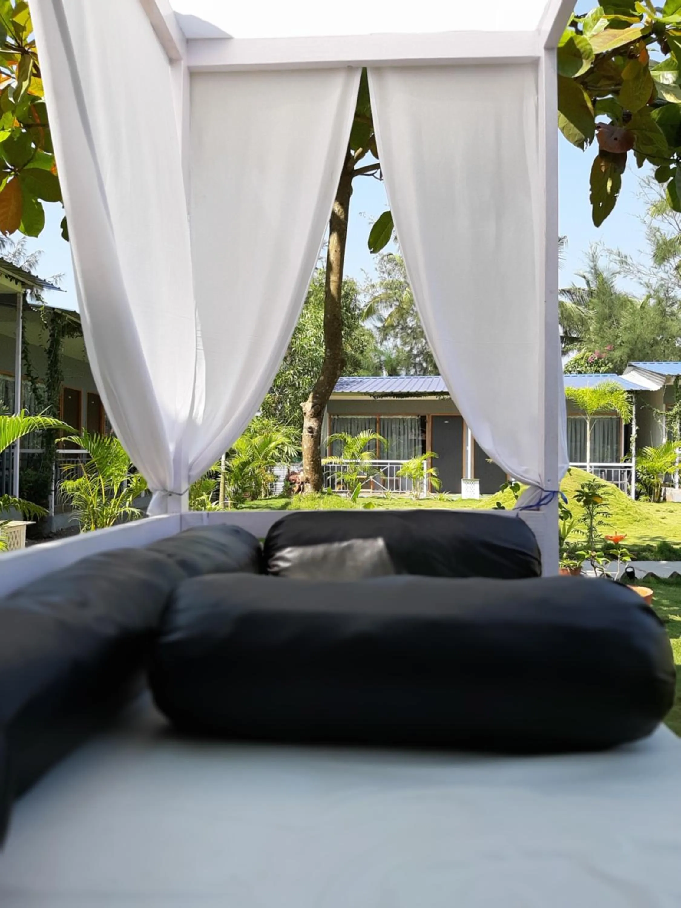 Seating area, Bed in Treebo Lands End Beach Resort - 100m from Beach