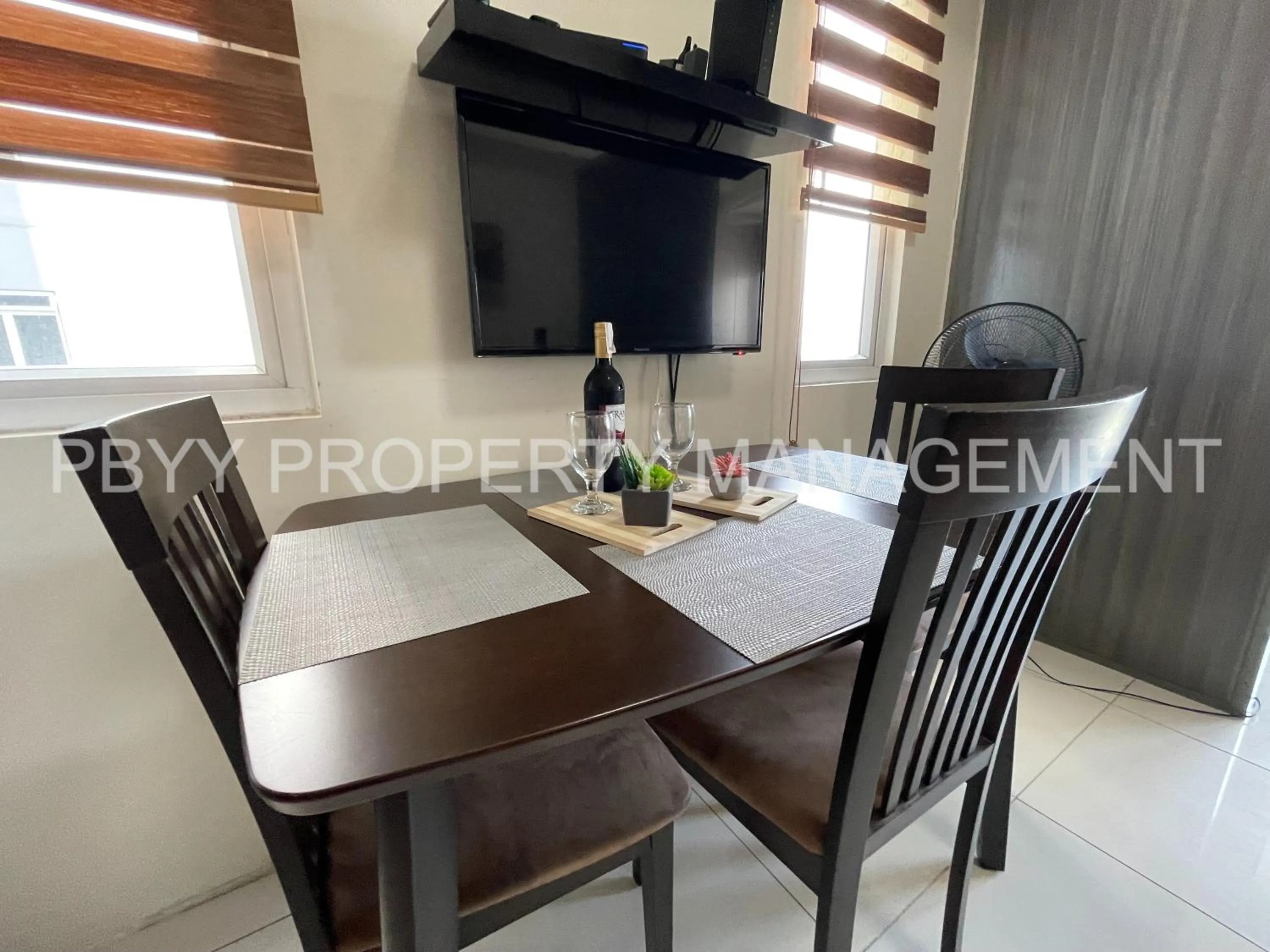 Dining Area in Green Residences Stays by PBYY