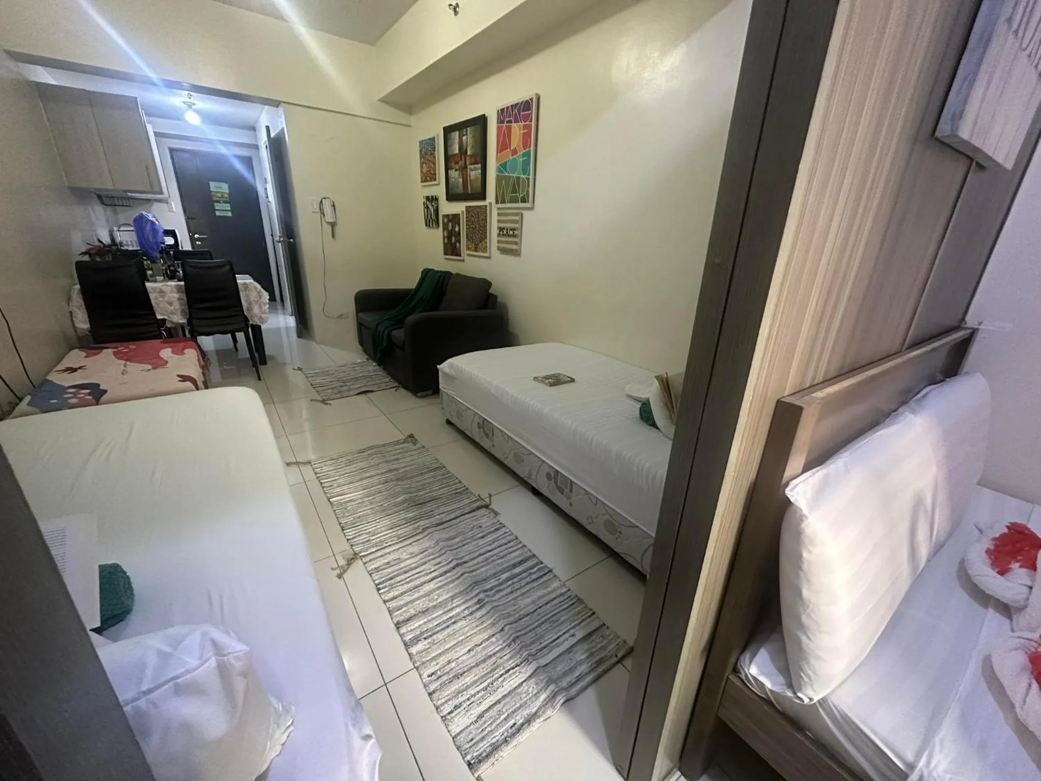 Bed in Green Residences Stays by PBYY