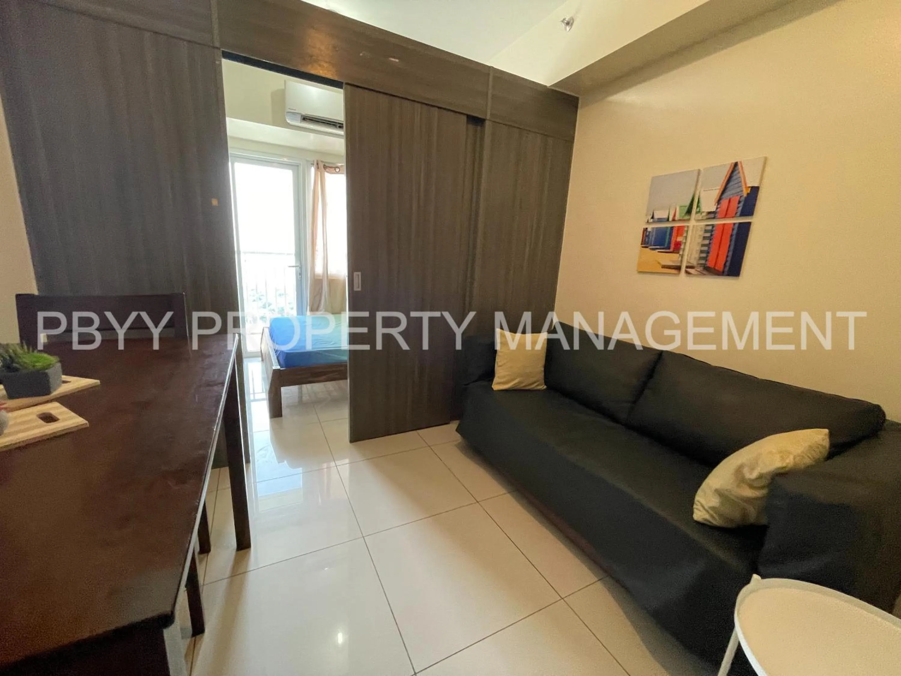 Living room in Green Residences Stays by PBYY