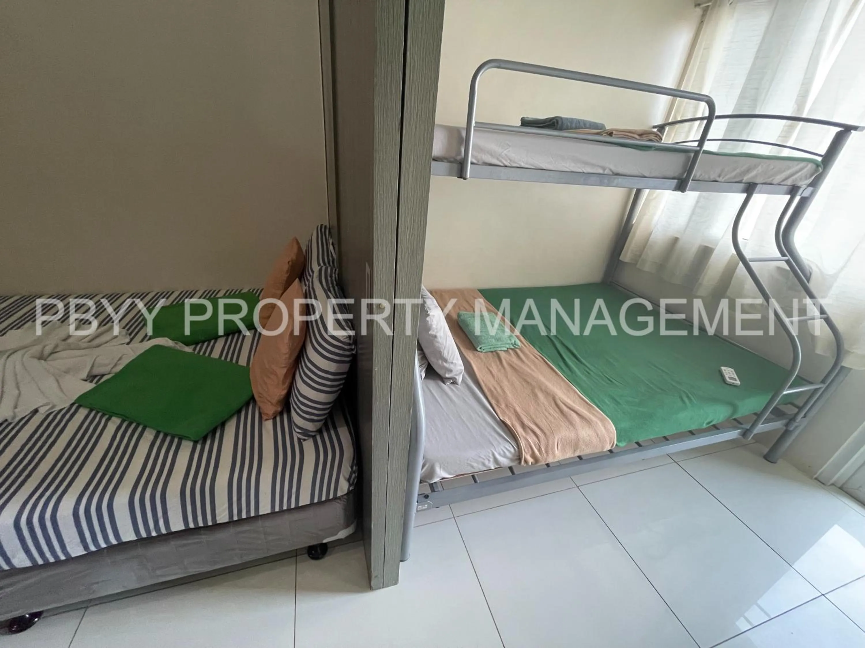 Bed, Bunk Bed in Green Residences Stays by PBYY