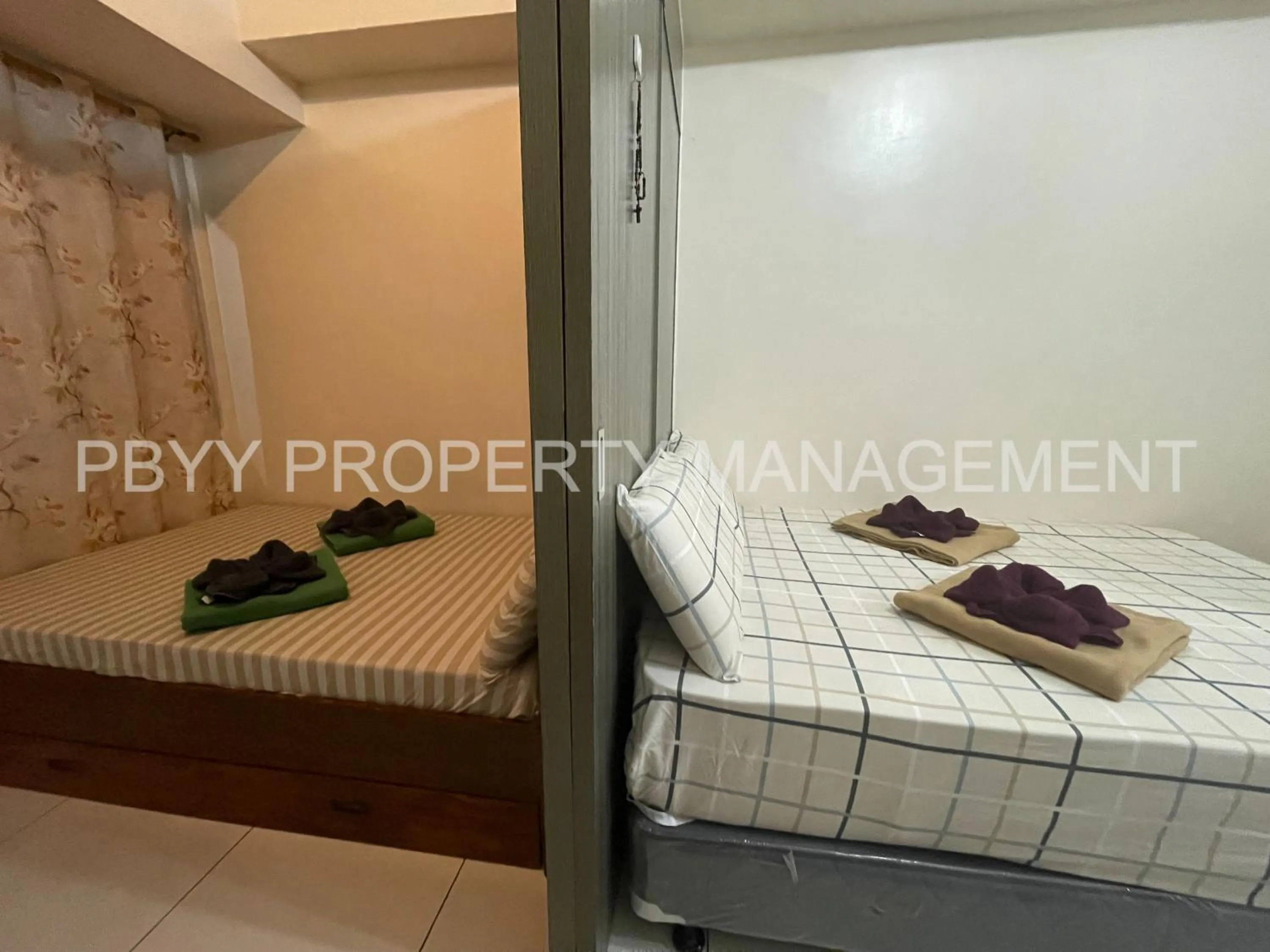 Bed in Green Residences Stays by PBYY