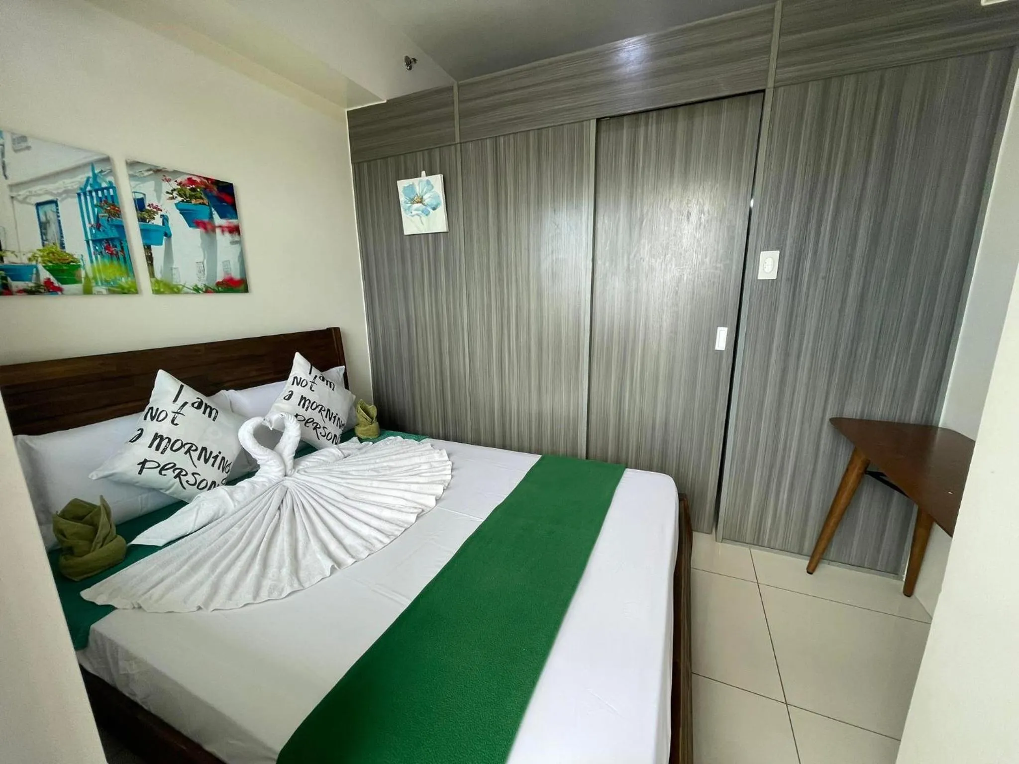 Bed in Green Residences Stays by PBYY