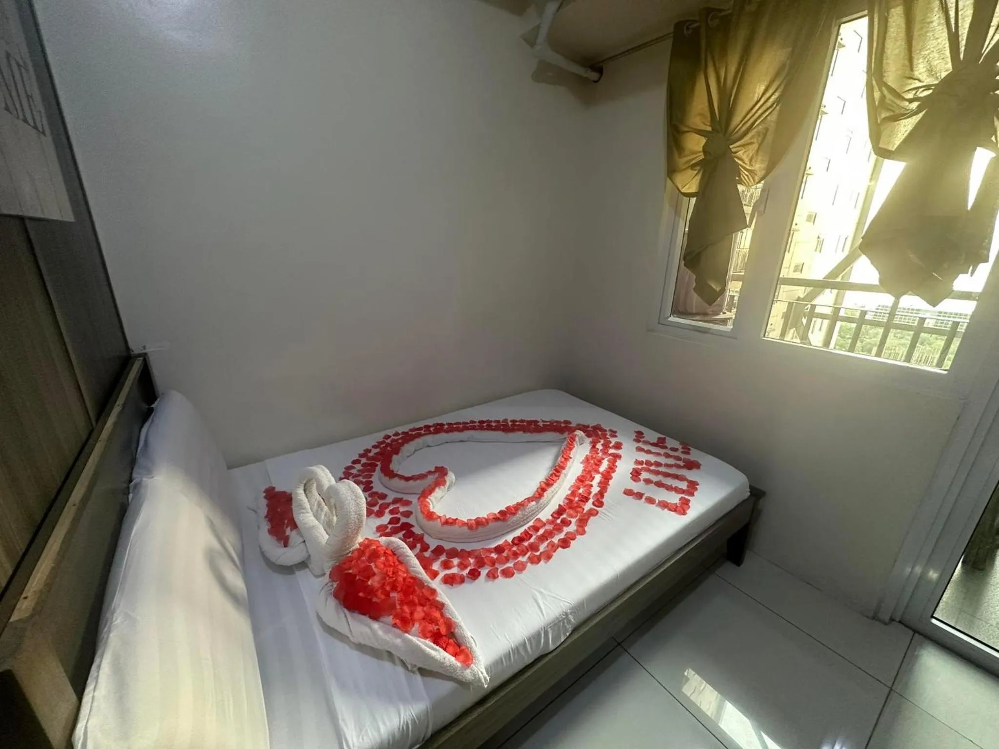 Bed in Green Residences Stays by PBYY