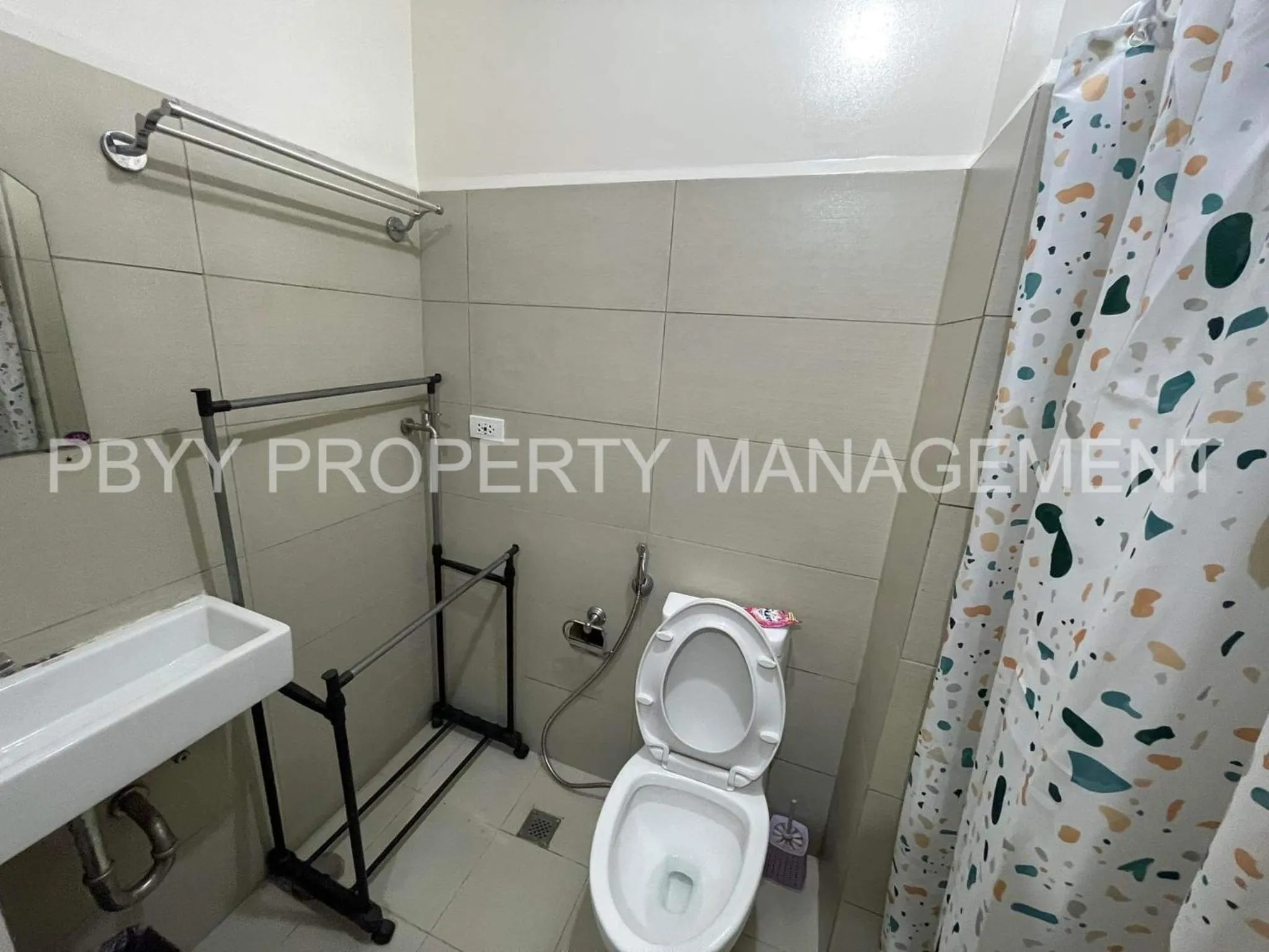 Bathroom in Green Residences Stays by PBYY