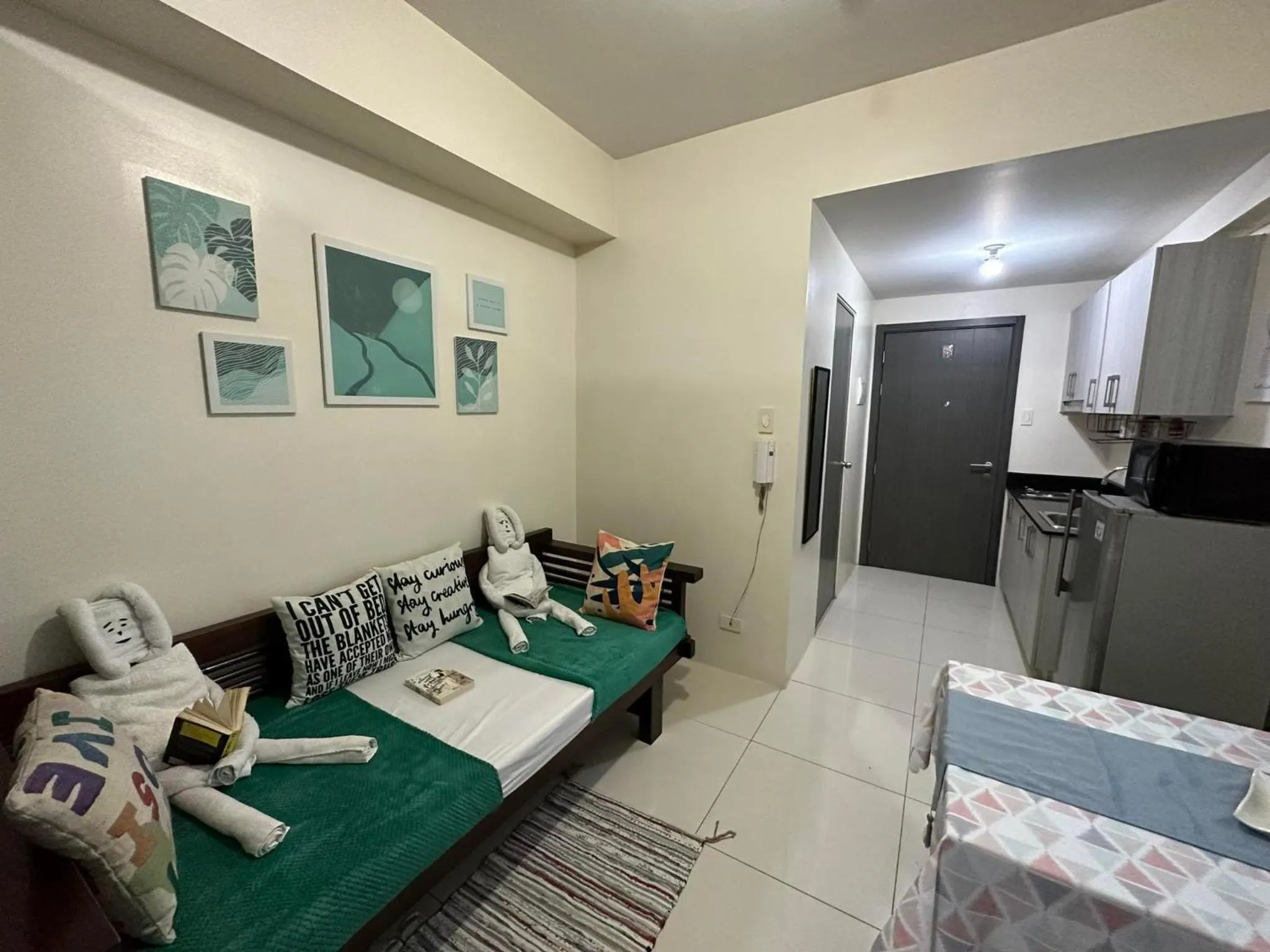 Bed, Seating Area in Green Residences Stays by PBYY