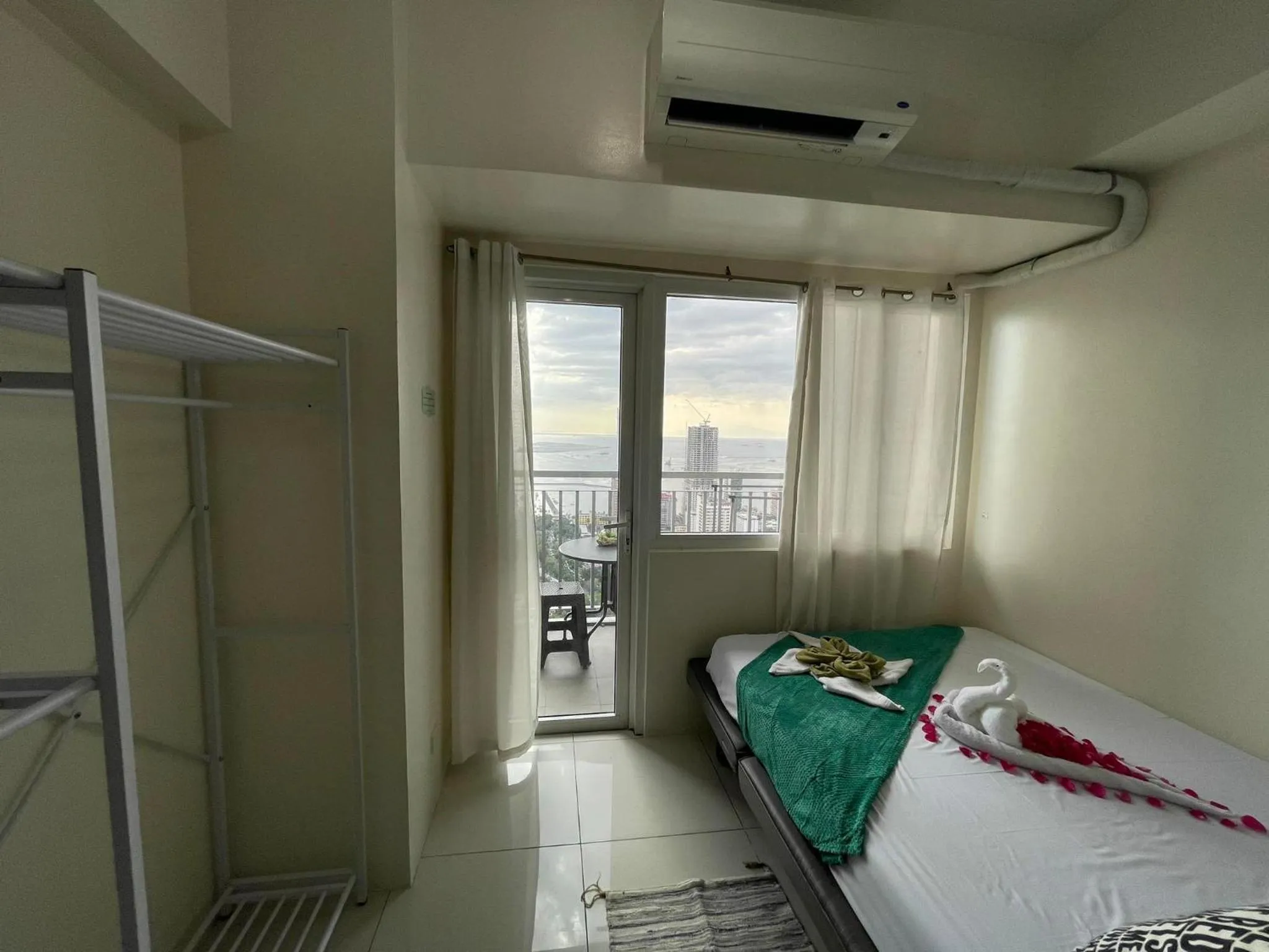 Bed in Green Residences Stays by PBYY