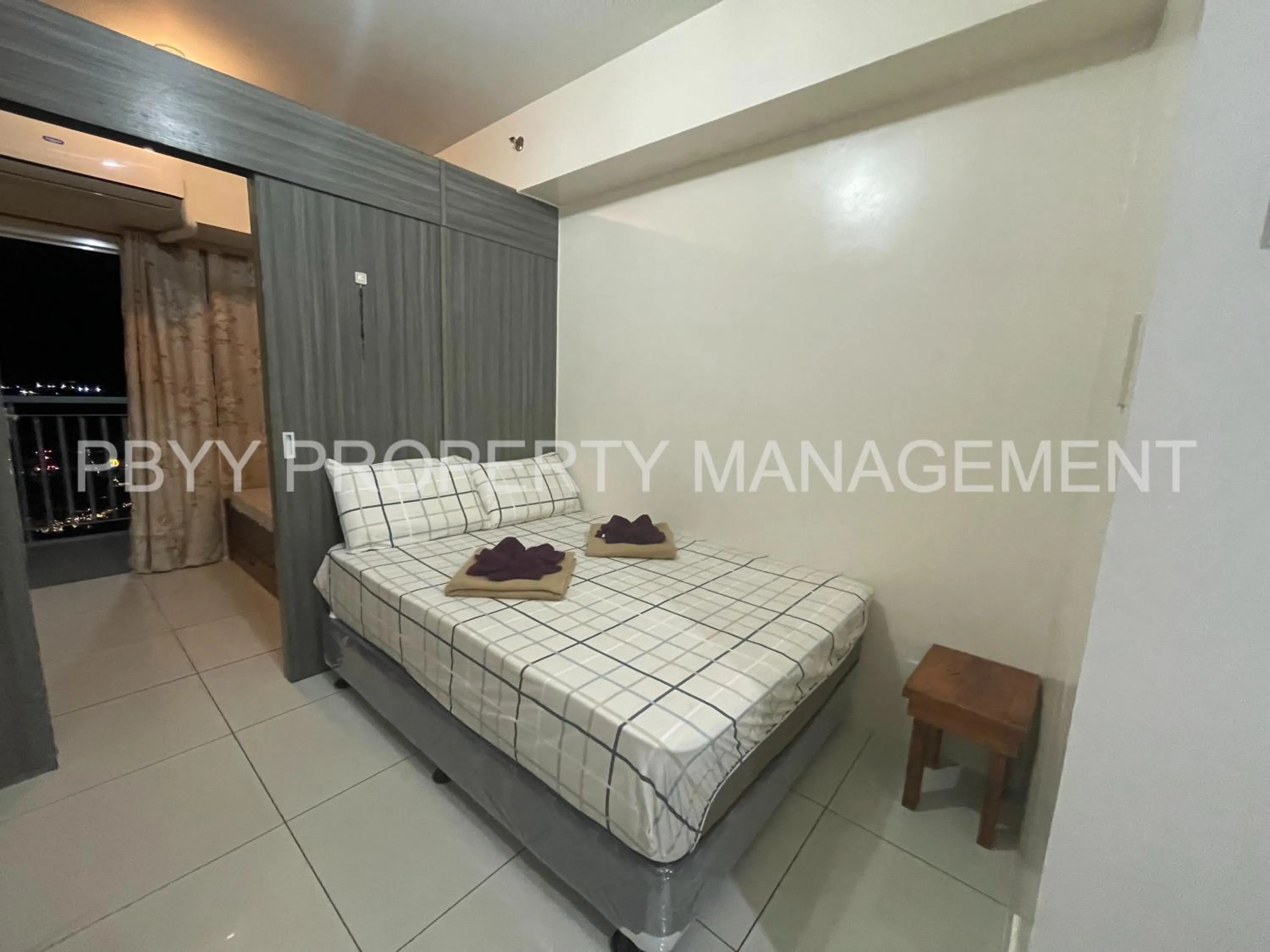 Bed in Green Residences Stays by PBYY