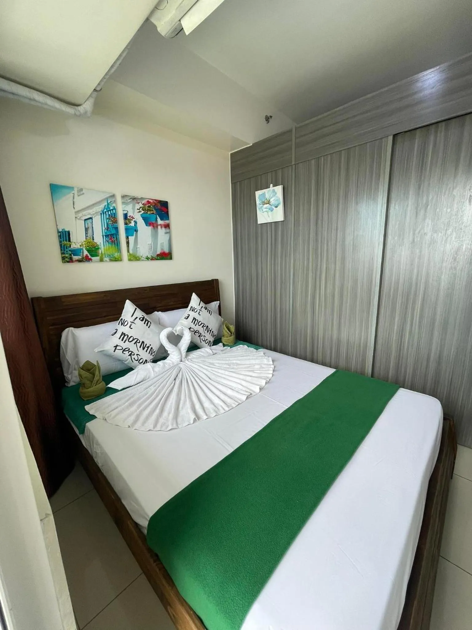 Bed in Green Residences Stays by PBYY