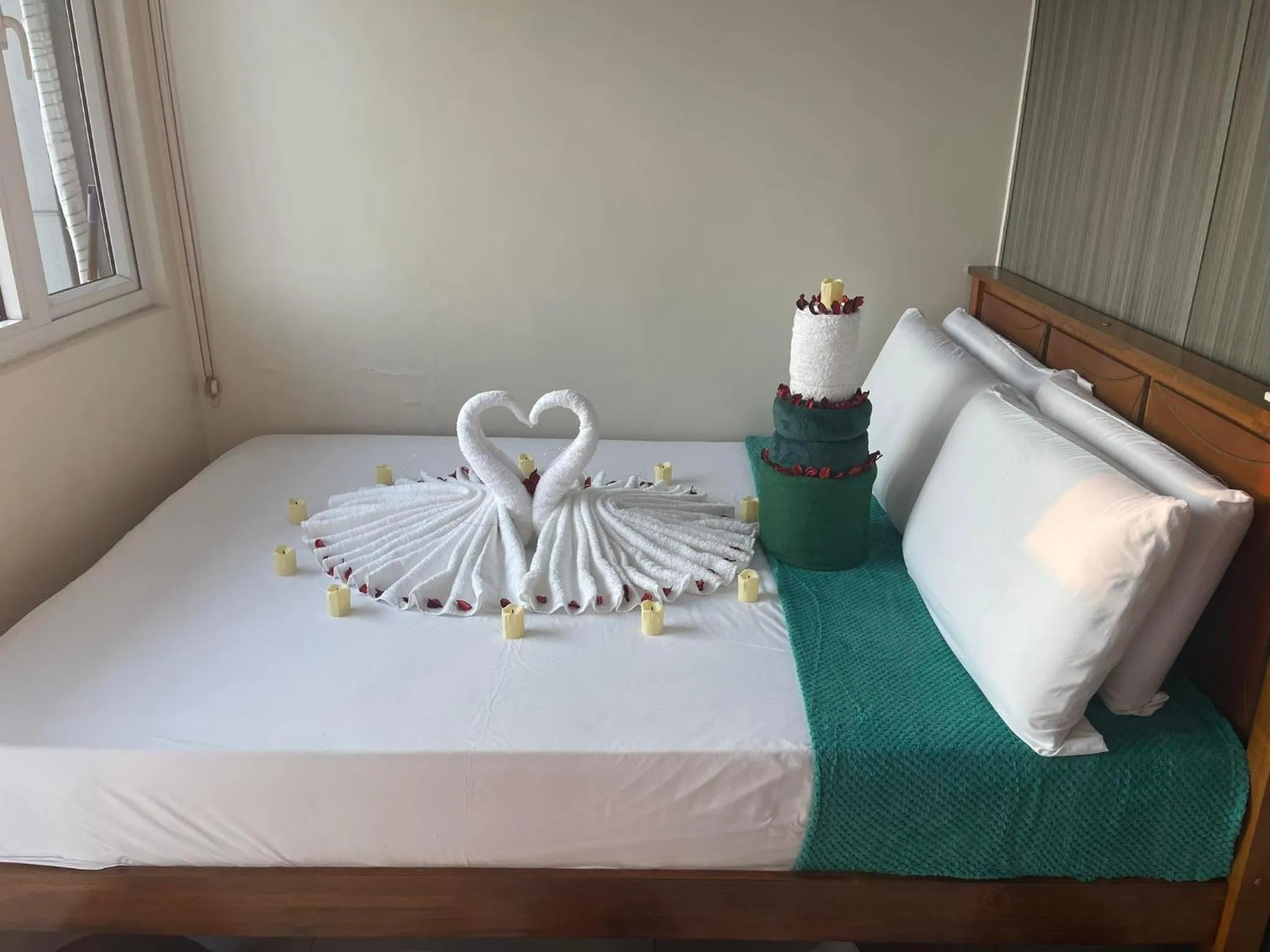 Bed in Green Residences Stays by PBYY