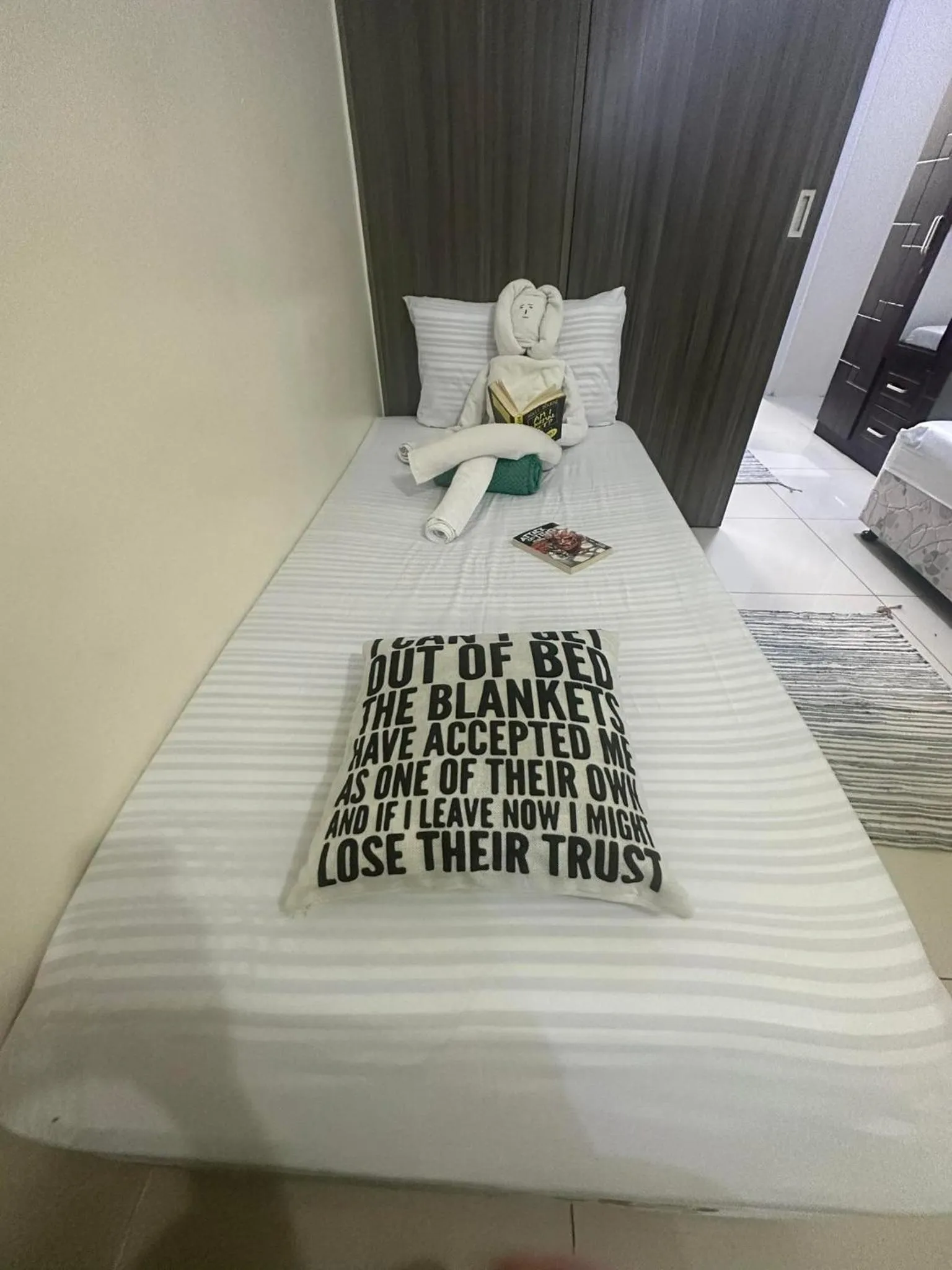 Bed in Green Residences Stays by PBYY