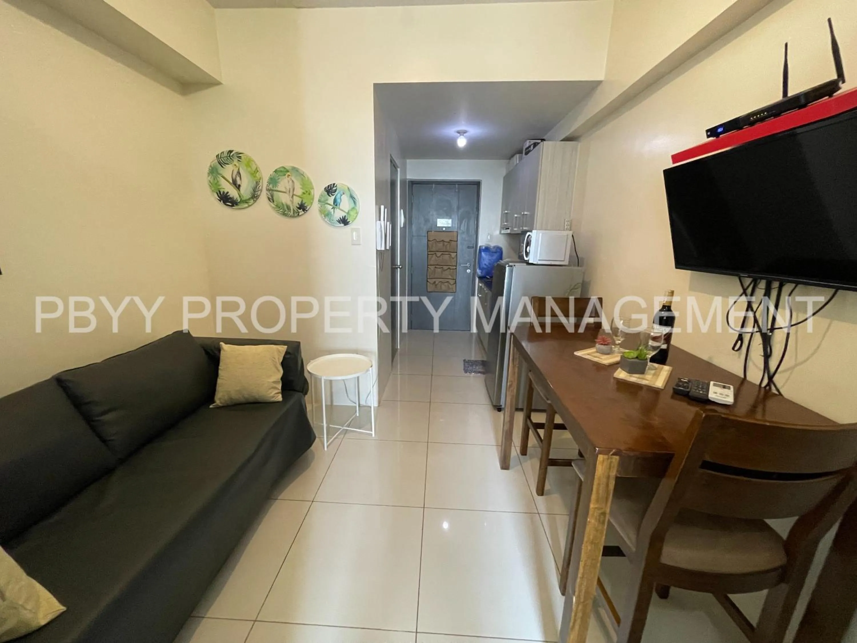 TV and multimedia, Seating Area in Green Residences Stays by PBYY